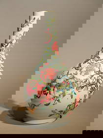 FAMILLE ROSE POMEGRANATE BOTTLE VASE: Famille rose pomegranate bottle vase. Height: 37 cm.