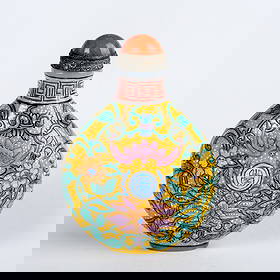 A FAMILLE ROSE 'FLOWER' SNUFF BOTTLE: A famille rose 'flower' porcelain snuff bottle.2.56"h x 1.77"w (6.5 x 4.5 cm)