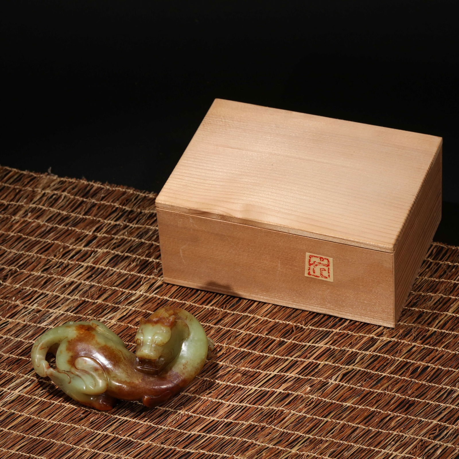 RUSSET AND CELADON JADE CHI-DRAGON CARVING: Russet and celadon jade chi-dragon carving. Height: 5 cm, Width: 12.3 cm.