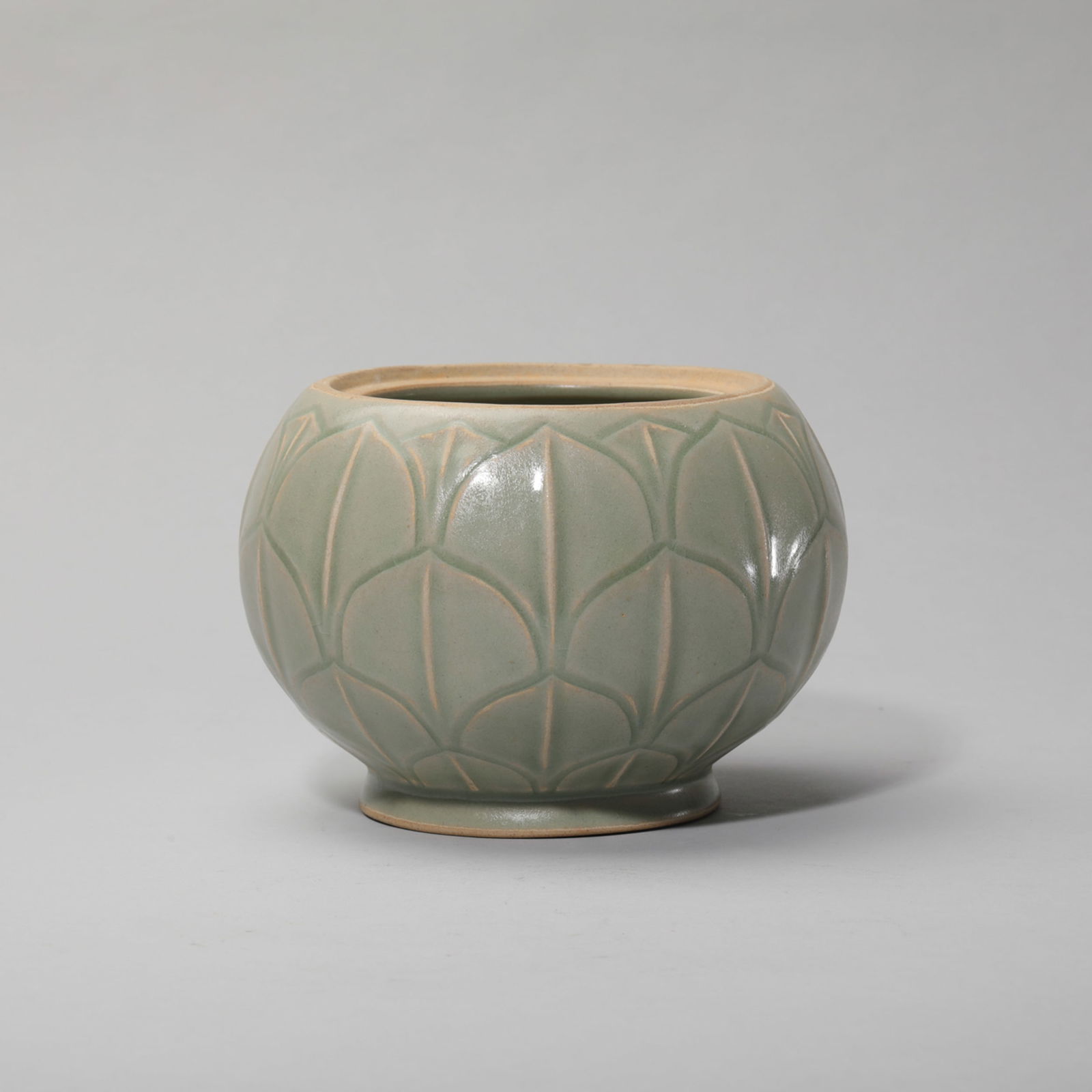 CELADON GLAZE LOTUS-PETAL ALMS BOWL: Celadon glaze lotus-petal alms bowl. Height: 11 cm, Mouth Diam.: 11 cm.
