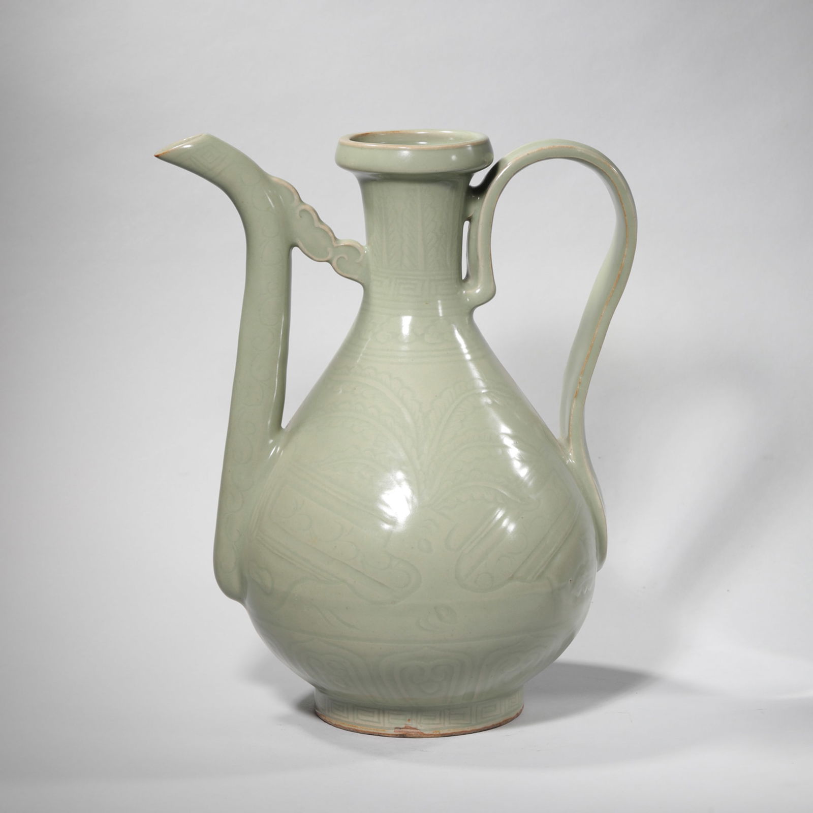 CELADON GLAZE INCISED EWER: Celadon glaze incised ewer. Height: 31 cm, Width: 26 cm.