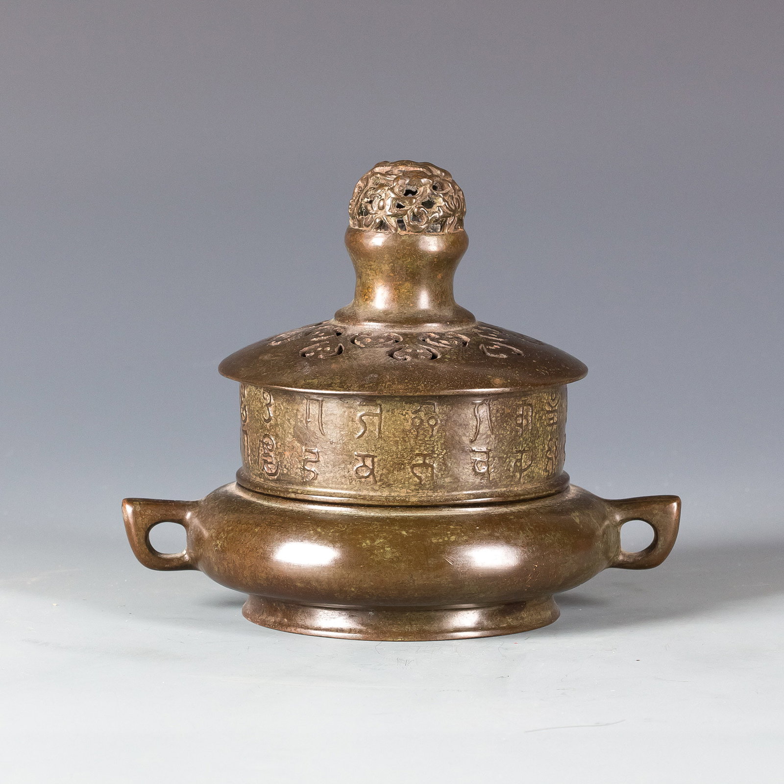 CHINESE BRONZE CENSER: Chinese Bronze Censer with two loop handles on the side and one hollowed carved ball as the cover. Diameter 6" x? Width 8" x Height 6.75"