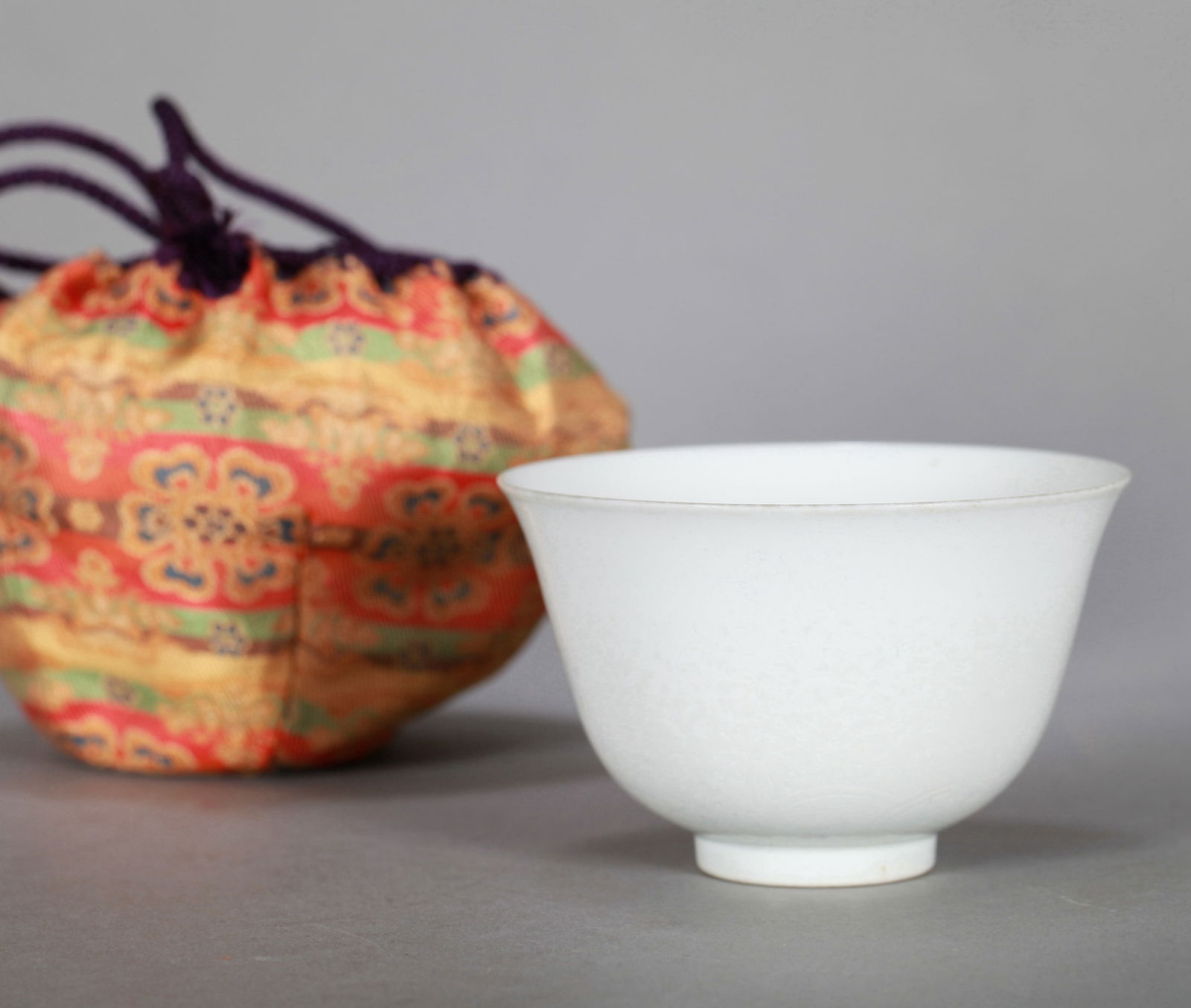 A WHITE-GLAZED BOWL: A white-glazed bowl decorated with incised dragon design. Height 6 cm, Diameter 9.5 cm.