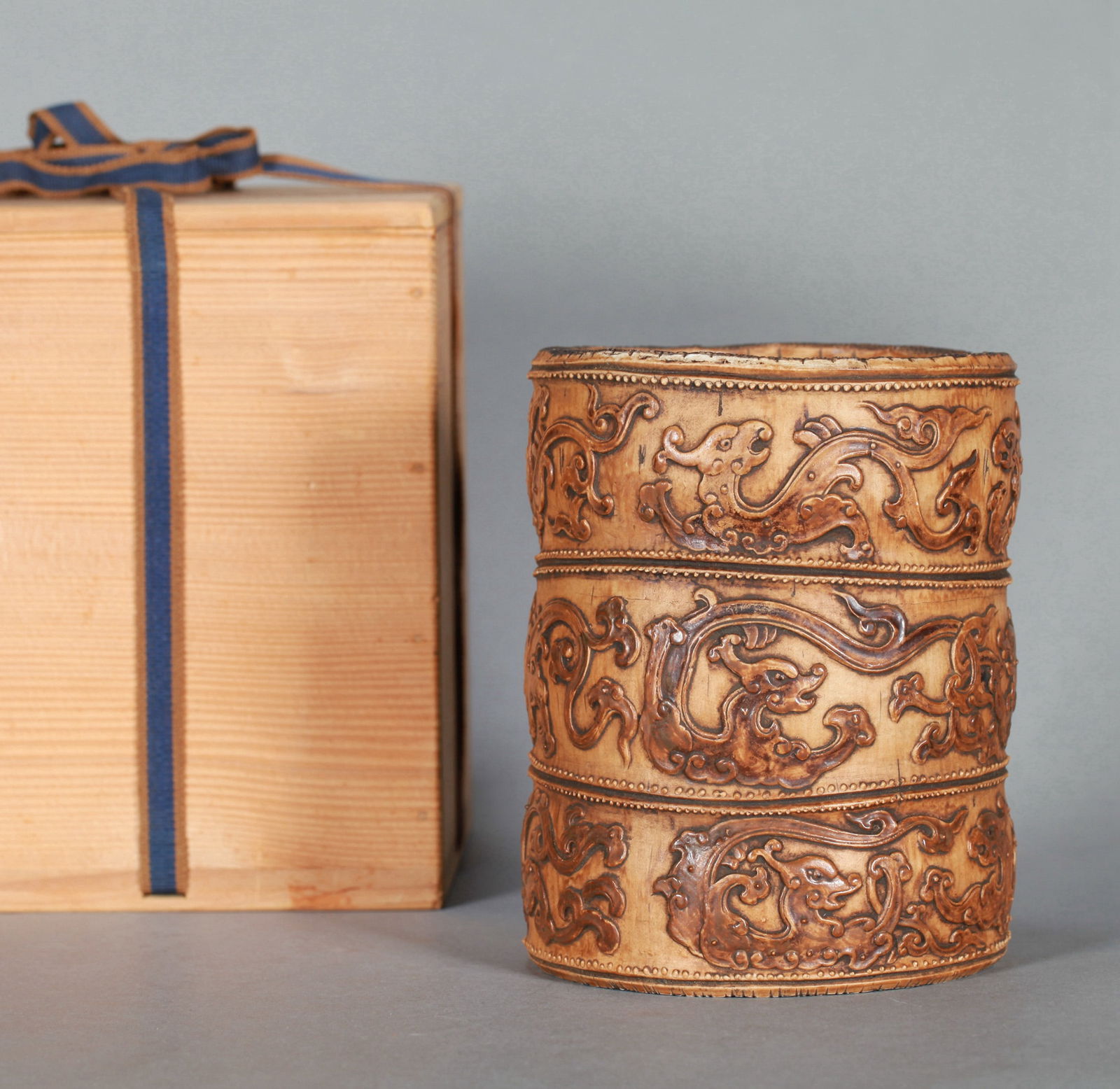 A CARVED PORCELAIN BRUSH POT (1 of 6)