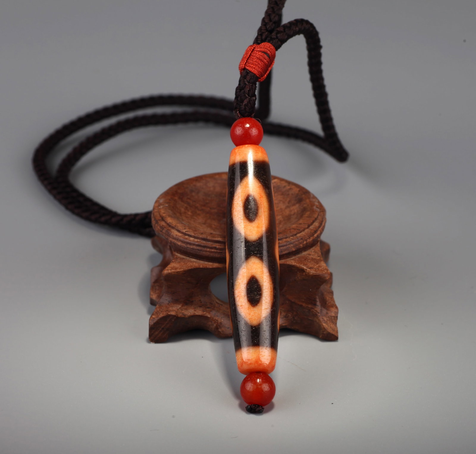 A THREE-EYED DZI BEAD (1 of 11)