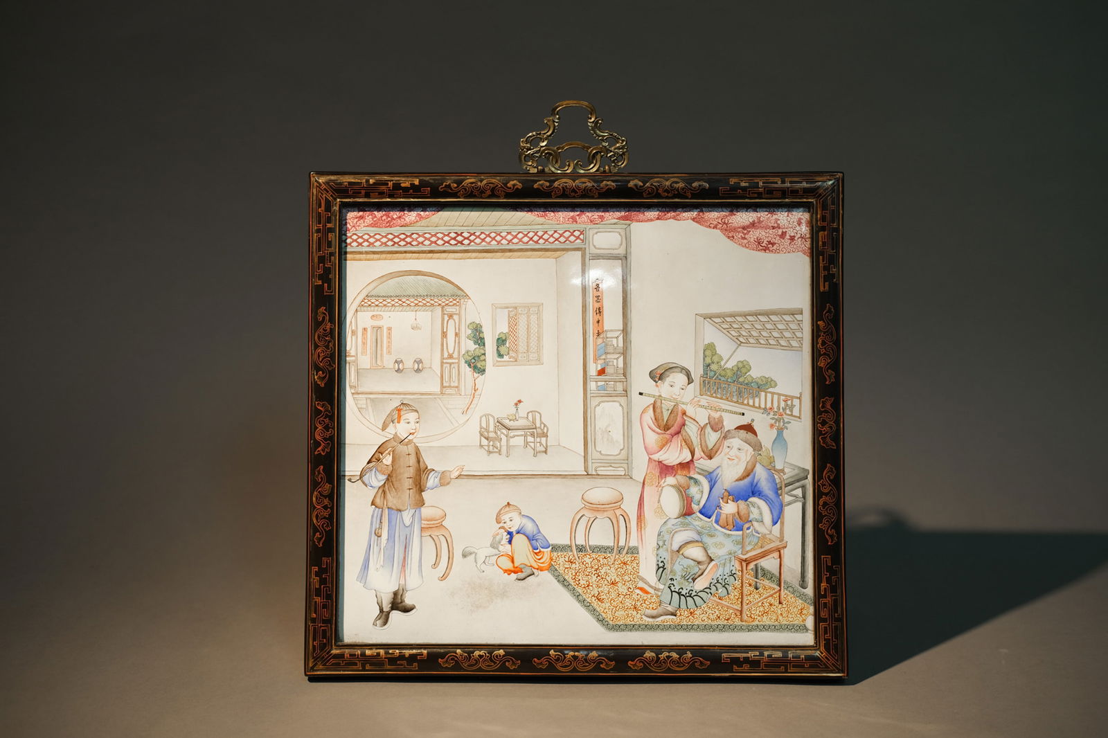 ENAMEL PAINTED FIGURE STORY HANGING SCREEN: Enamel painted figure story hanging screen.Dimensions: Length: 33.8 cm, Height: 31.8 cm.