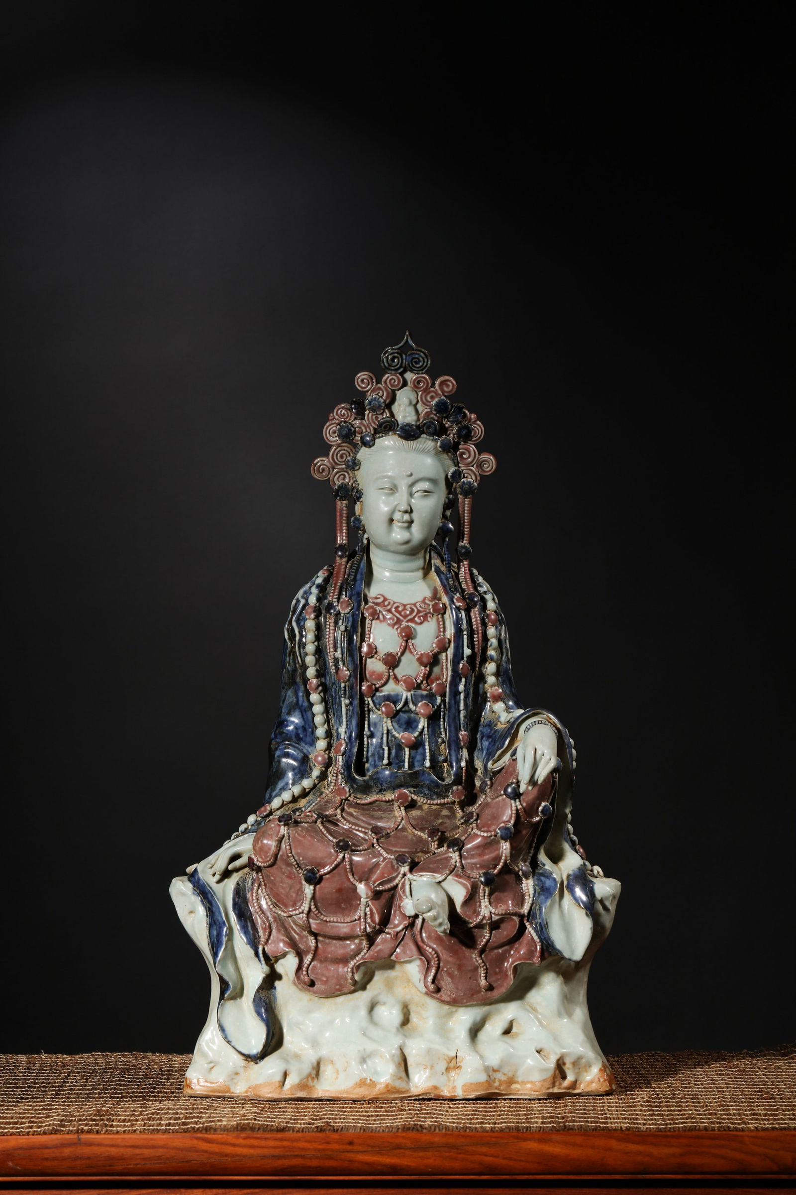 COPPER-RED AND BLUE GLAZE GUANYIN STATUE: Copper-red and blue glaze Guanyin statue. Dimensions: Height: 53 cm, Width: 32 cm.