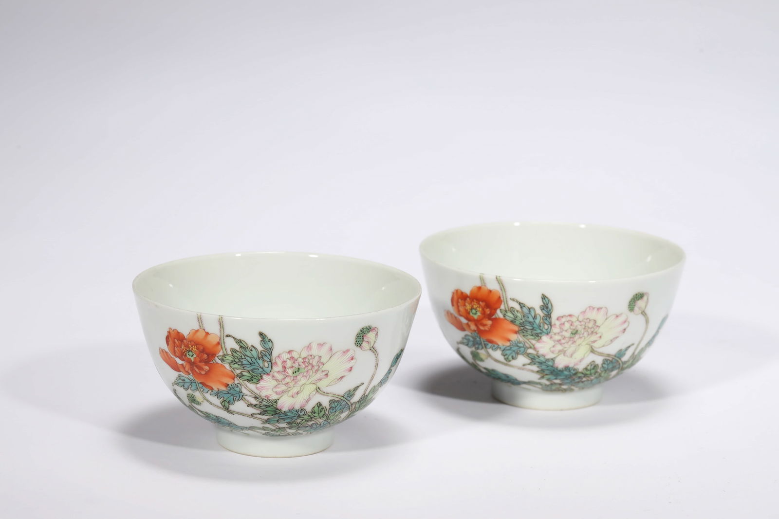 PAIR OF FAMILLE ROSE FLOWER BUBBLE BOWLS: Pair of famille rose flower bubble bowls.Dimensions: Diameter: 10 cm, Height: 5.7 cm.