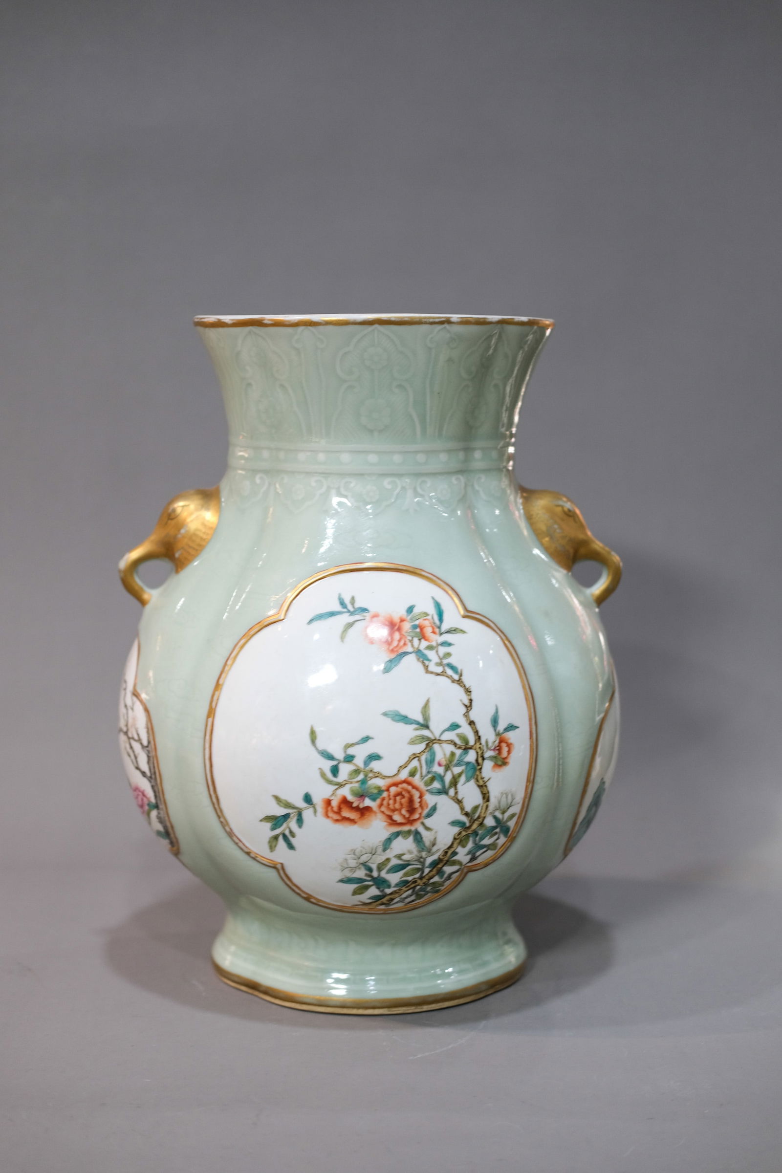 CELADON GLAZE AND FAMILLE ROSE FLOWER DOUBLE ELEPHANT-EARED ZUN: Celadon glaze and famille rose flower double elephant-eared zun.Dimensions: Height: 38 cm.