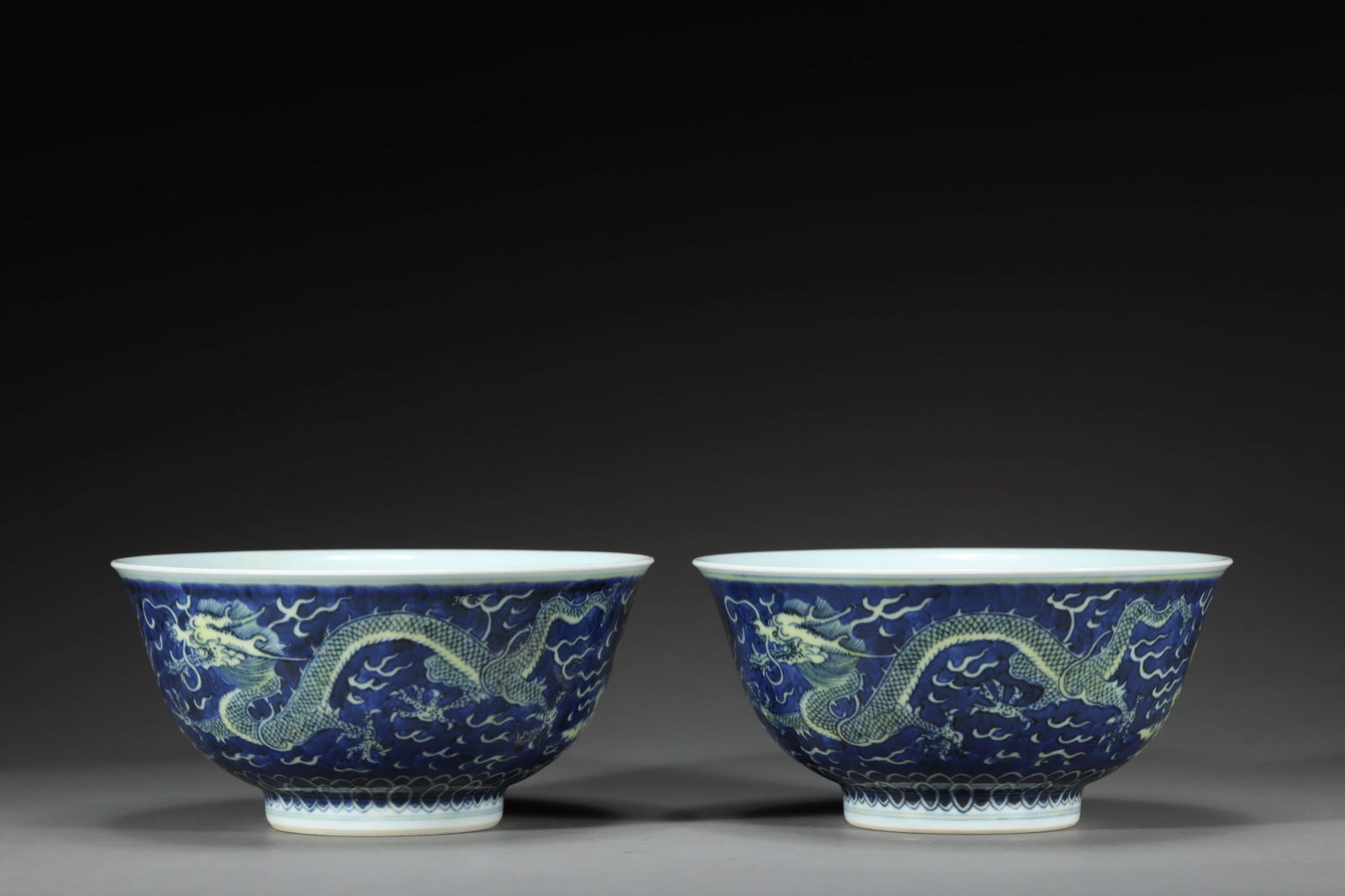 PAIR OF DAOGUANG BLUE-GROUND AND GREEN-GLAZE DRAGON BOWLS: Pair of Daoguang blue-ground and green-glaze dragon bowls. Dimensions: Height: 6.6 cm, Diameter: 13.5 cm.