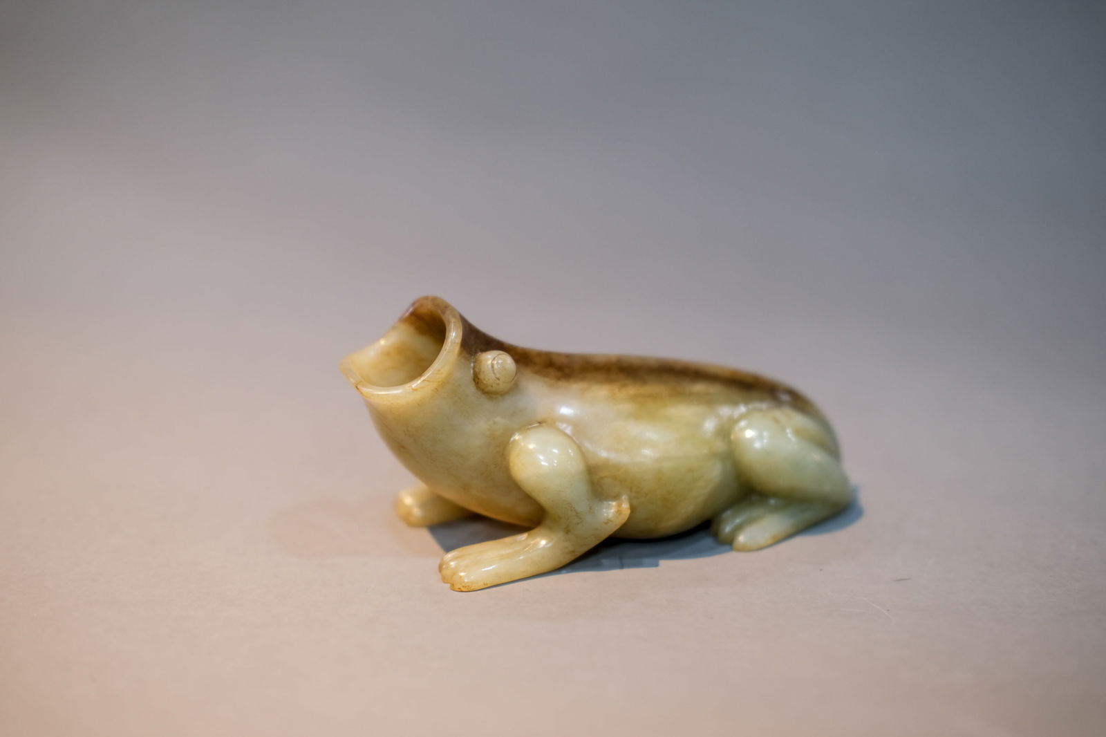 RUSSET JADE BEAST ORNAMENT: Russet jade beast ornament. Dimensions: Length: 12 cm, Height: 5.7 cm.