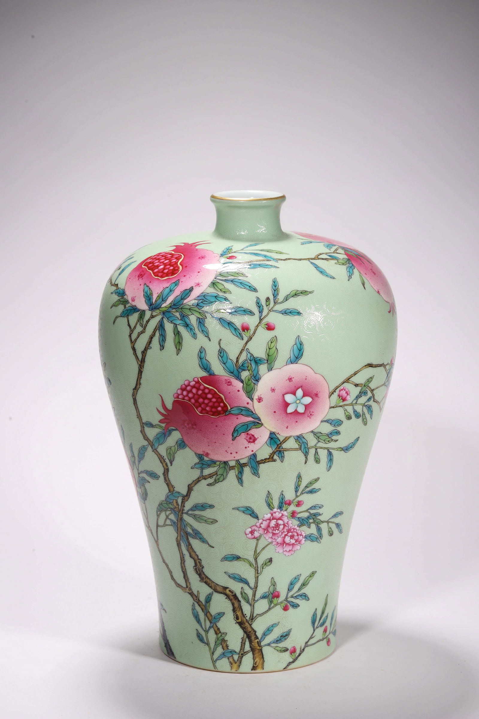 GREEN GLAZE FAMILLE ROSE POMEGRANATE AND PEACH MEIPING: Green glaze famille rose Pomegranate and Peach meiping. Dimensions: Height: 31 cm, Width: 20.5 cm.