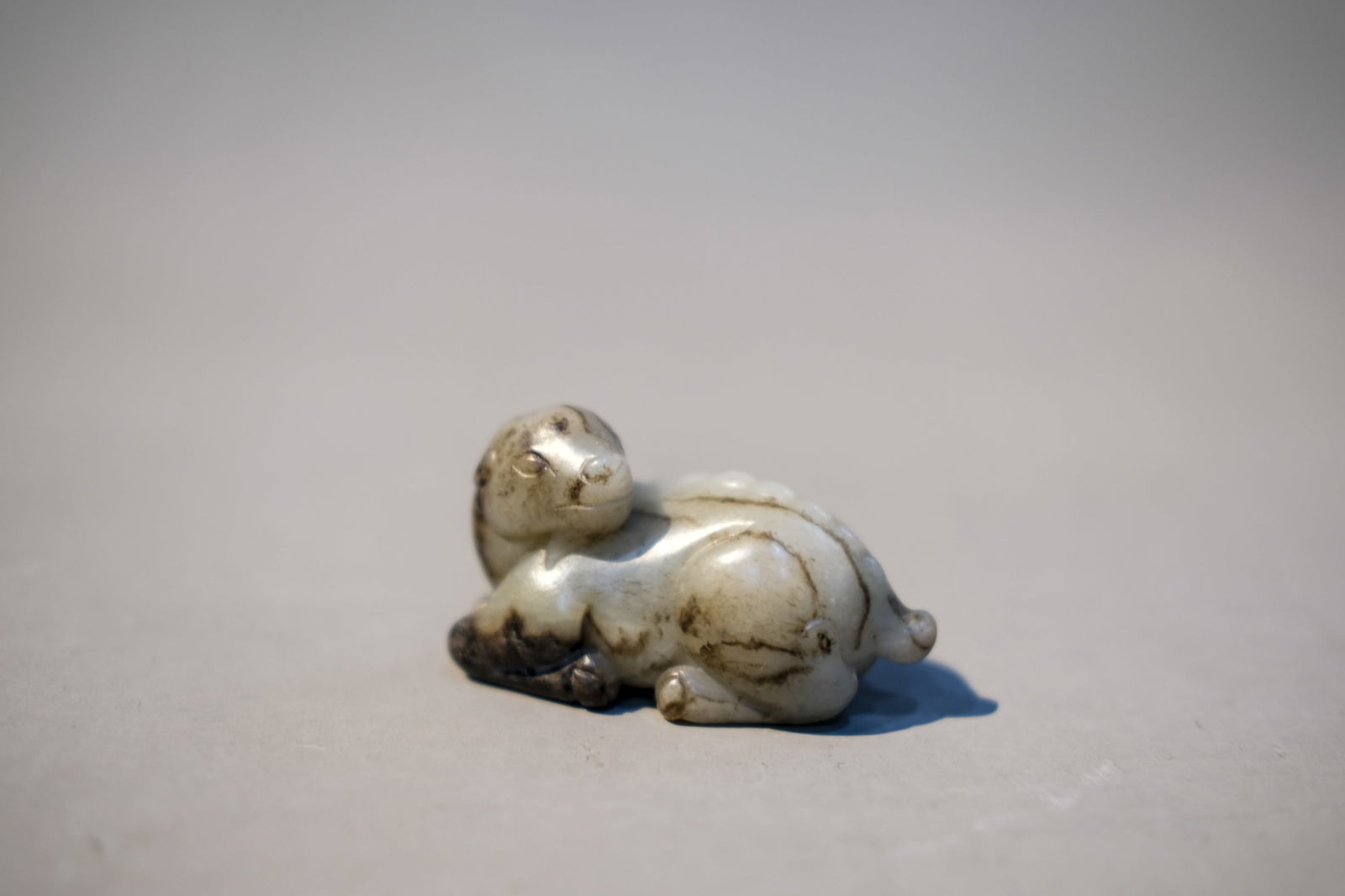 CARVED RUSSET JADE ORNAMENT: Carved russet jade ornament.Dimensions: Length: 6.5 cm, Height: 3.9 cm.