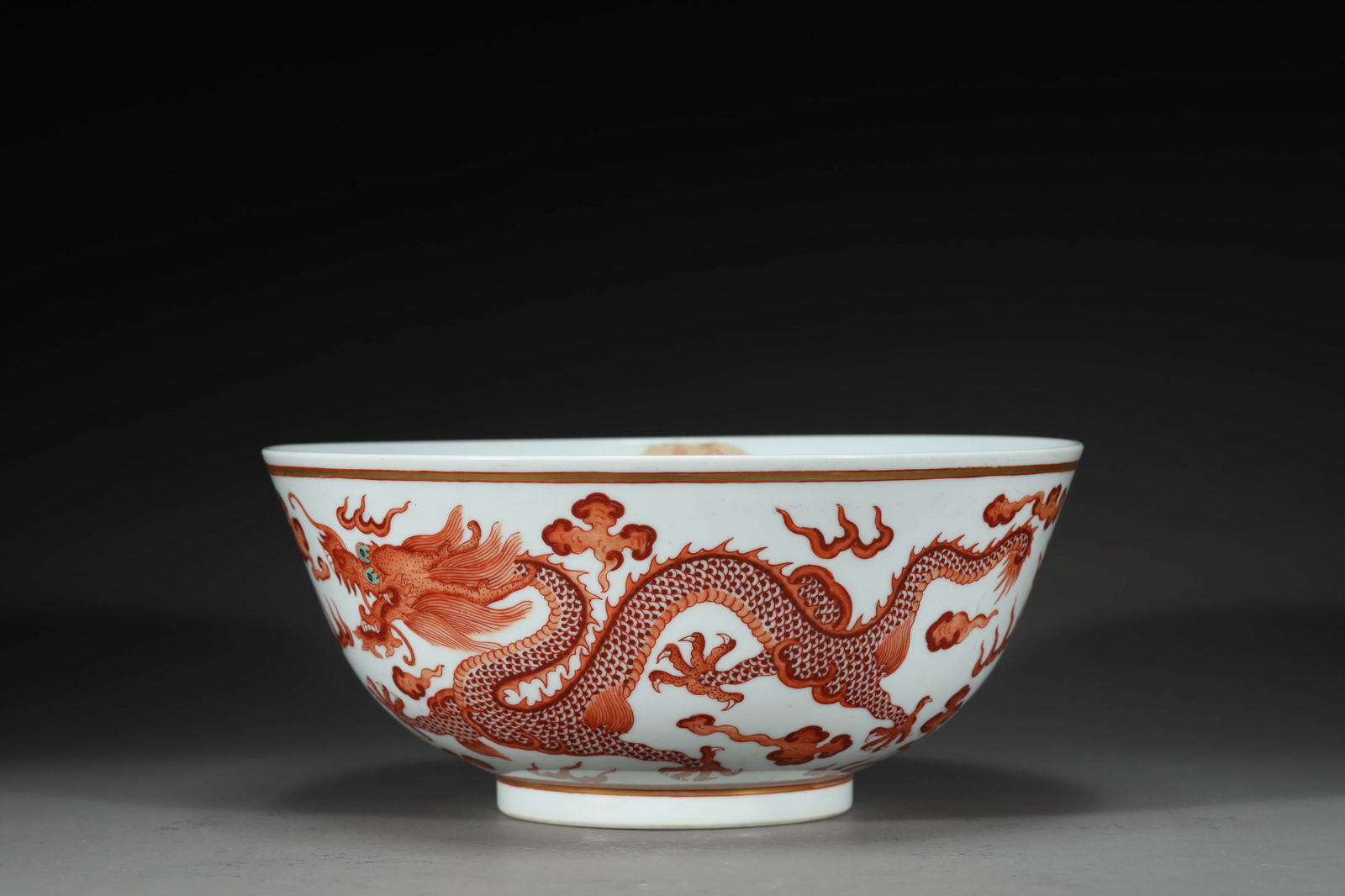 GUANGXU IRON-RED GLAZE DRAGON BOWL: Guangxu iron-red glaze dragon bowl. Dimensions: Height: 9.2 cm, Diameter: 21 cm.