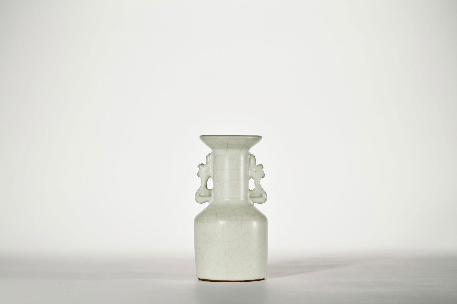 WHITE GLAZE TWIN-FISH-EARED VASE: White glaze twin-fish-eared vase. Dimensions: Height: 15 cm, Width: 7 cm.