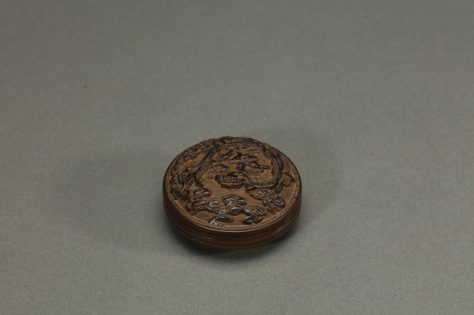 ENGRAVED BRONZE INK PASTE BOX AND COVER: Engraved bronze ink paste box and cover. Dimensions: Diameter: 6.8 cm.