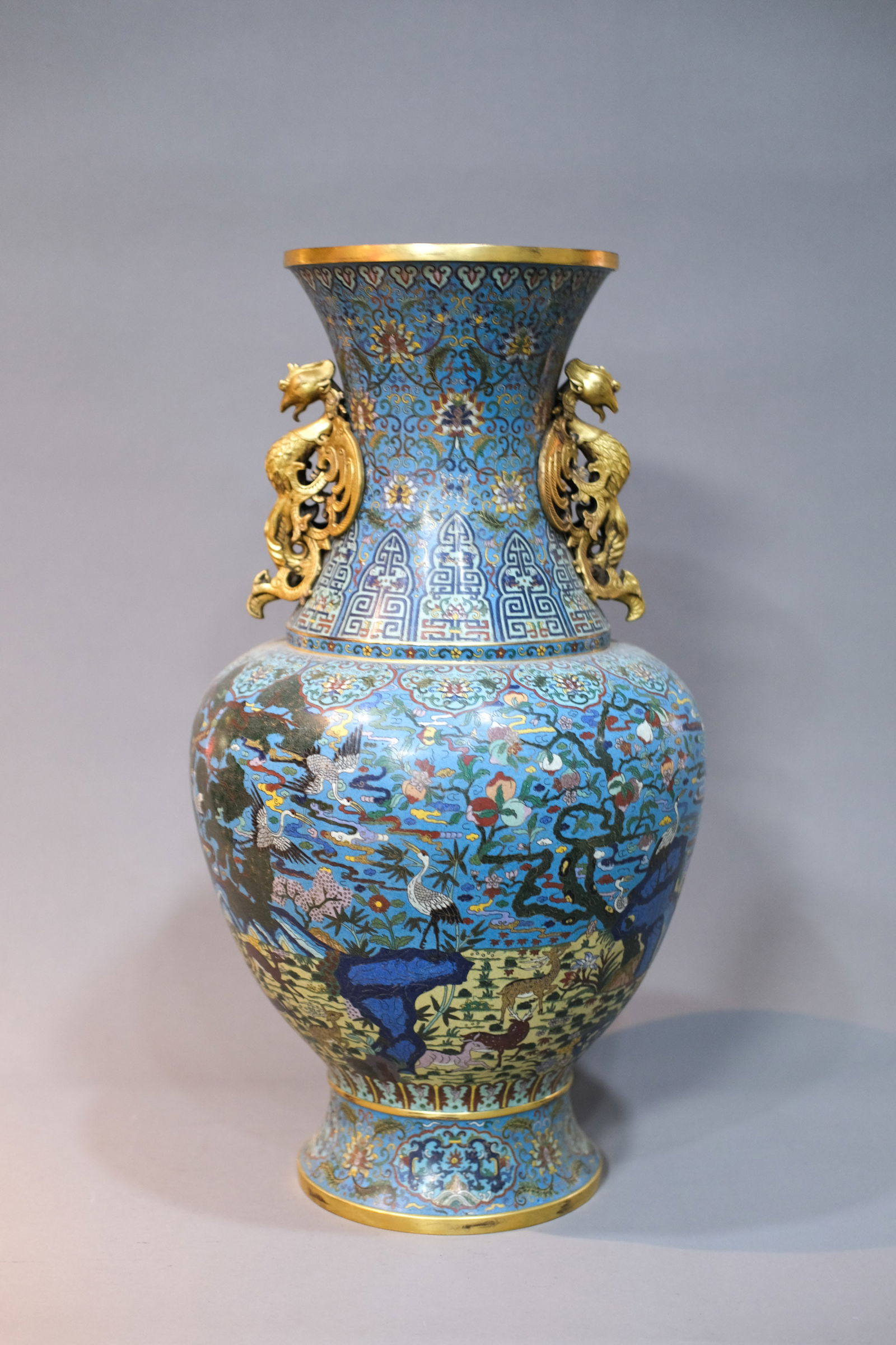 CLOISONNE ENAMEL CRANE AND DEER DOUBLE-EARED ZUN: Cloisonne enamel crane and deer double-eared zun.Dimensions: Height: 58.5 cm.