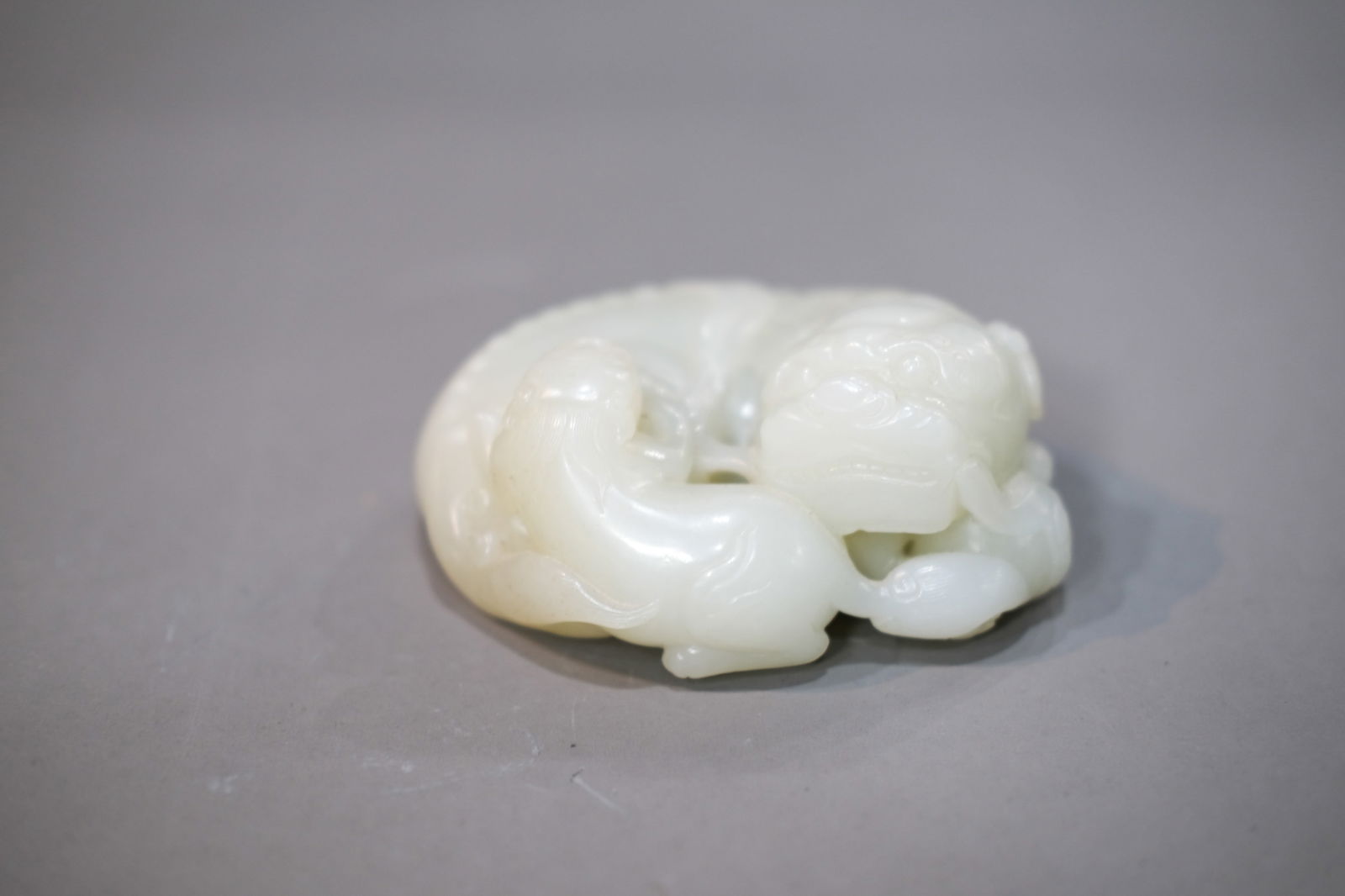 WHITE JADE LION GROUP: White jade lion group. Dimensions: Length: 11.5 cm.