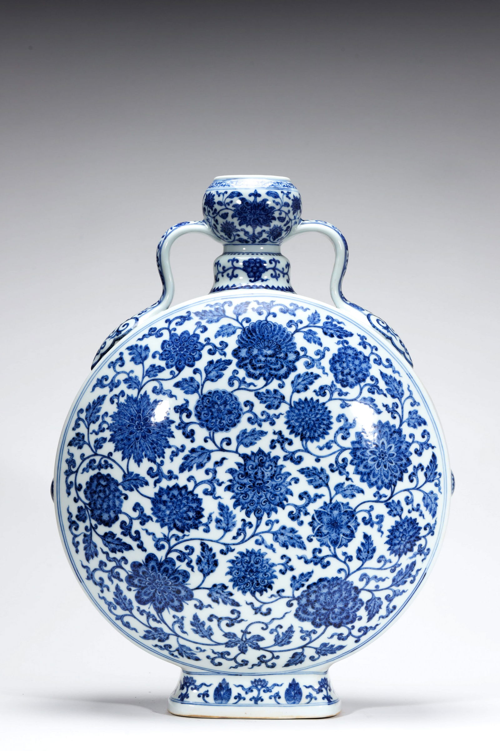 BLUE AND WHITE INTERLOCKING LOTUS MOONFLASK: Blue and white interlocking lotus moonflask. Dimensions: Width: 38 cm, Height: 51 cm.