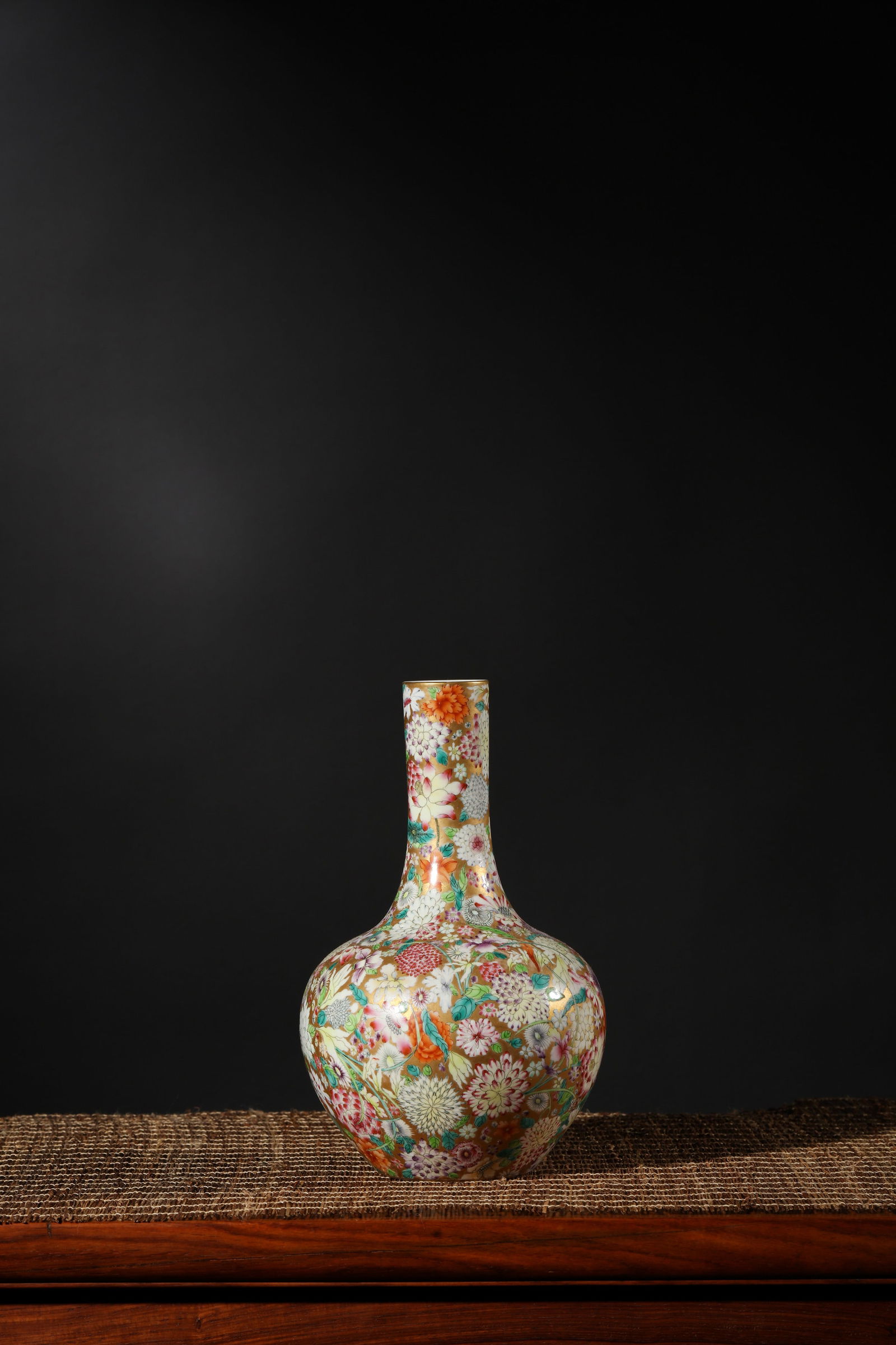 FAMILLE ROSE MILLEFLEURS TIANQIUPING VASE: Famille rose millefleurs tianqiuping vase.Dimensions: Height: 23.5 cm, Length: 14.5 cm.