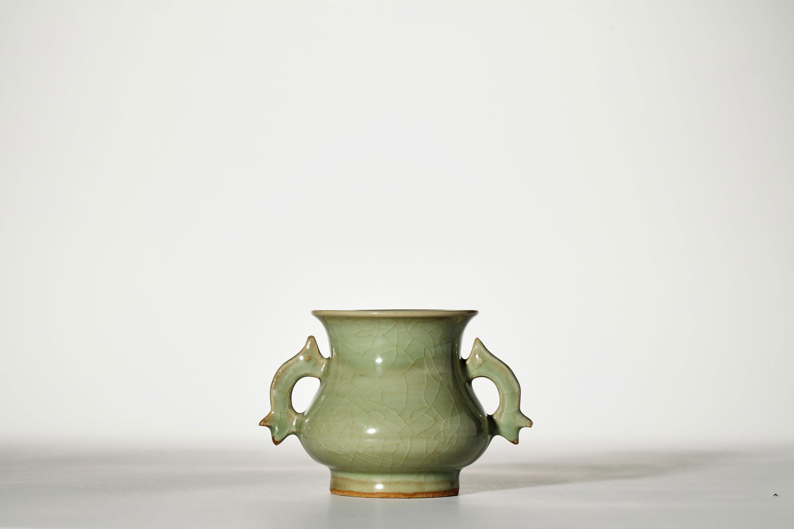 CELADON GLAZE DOUBLE-EARED CENSER: Celadon glaze double-eared censer. Dimensions: Height: 9 cm, Width: 13 cm.