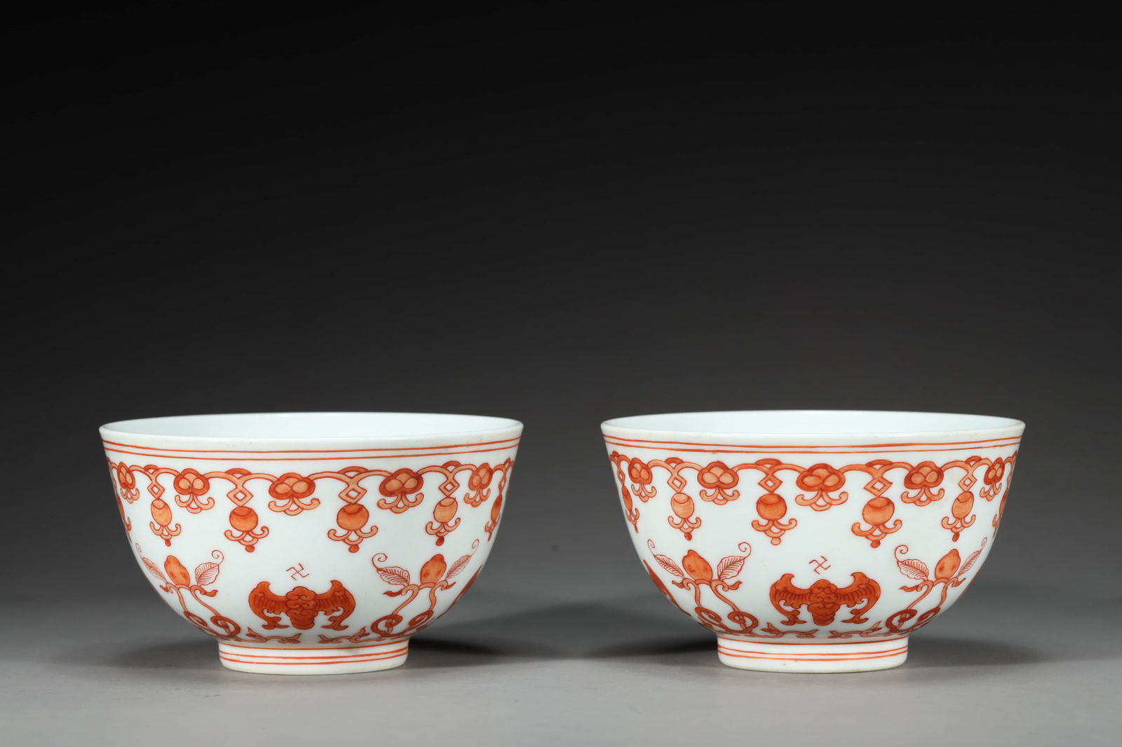 PAIR OF QING DAOGUANG PERIOD IRON-RED-GLAZED TEA BOWLS: Pair of Qing Daoguang period iron-red-glazed tea bowls.Dimensions: Height: 6.1 cm, Diameter: 10.7 cm.