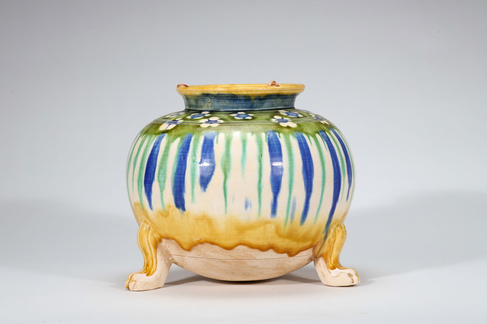 SANCAI-GLAZE TRIPOD FLORAL JUG: Sancai-glaze tripod floral jug.Dimensions: Height: 18.3 cm, Width: 20 cm.