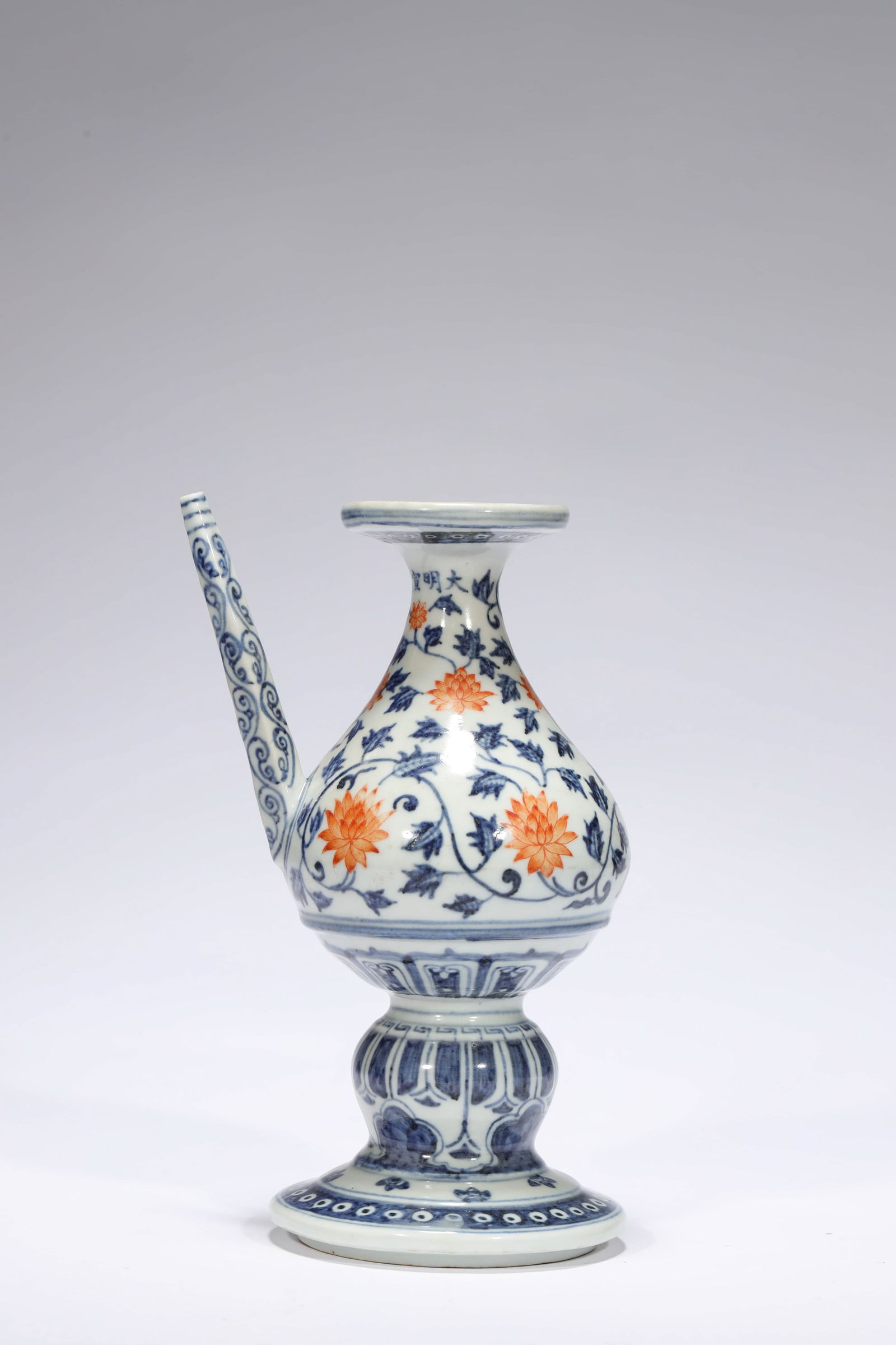 IRON-RED GLAZE FLORAL EWER: Iron-red glaze floral ewer. Dimensions: Height: 21.5 cm, Width: 14 cm.