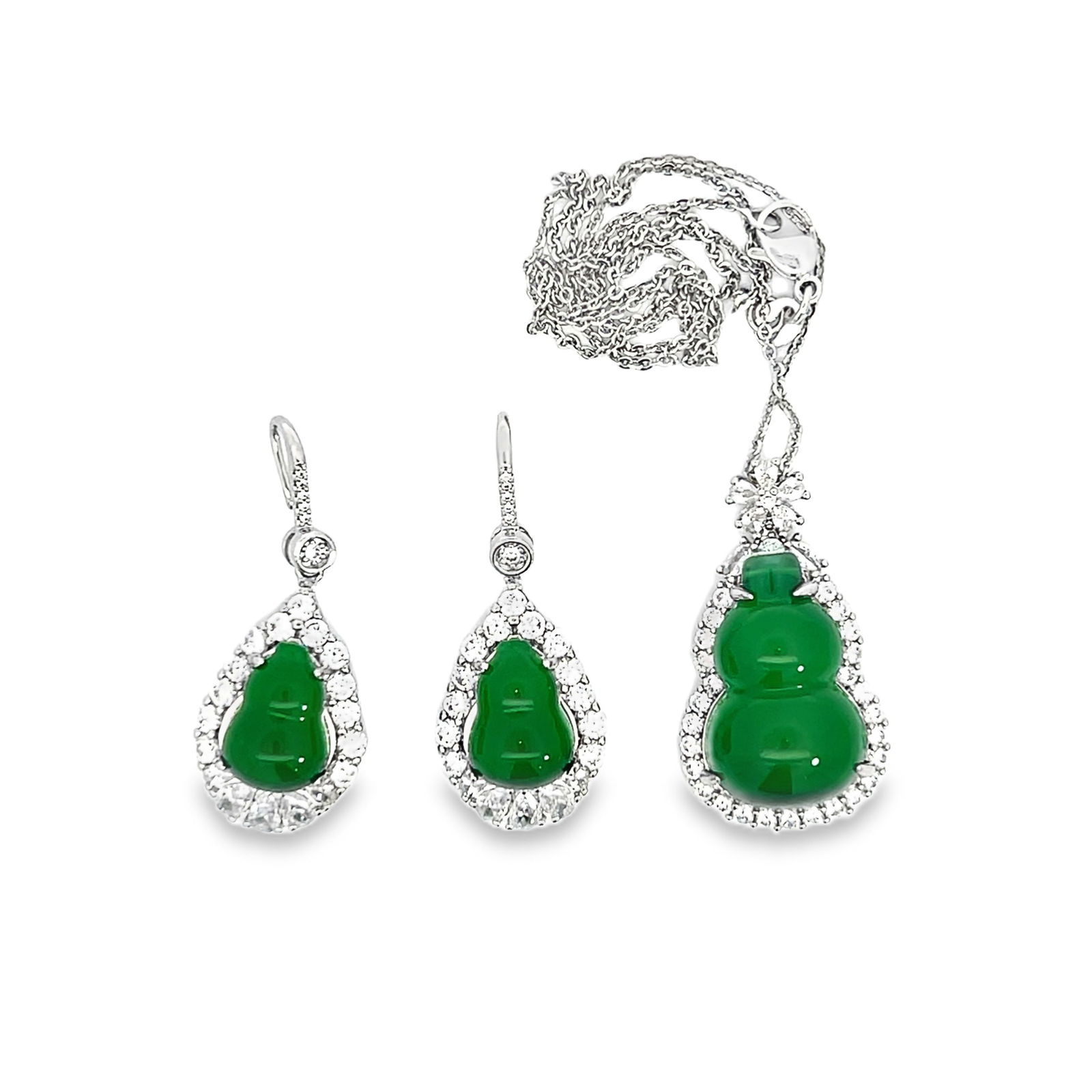 JADEITE, DIAMOND AND STERLING SILVER NECKLACE AND EARRINGS: (lot of 3) Jadite, diamond and sterling silver necklace and earrings. Pedant: 1.38"h x 0.79"w x 0.59"l (3.5 x 2 x 1.5 cm) Necklace: 18.11"l (46 cm) Earrings: 0.98"h x 0.59"w x 0.39"l (2.5 x 1.5 x 1 cm