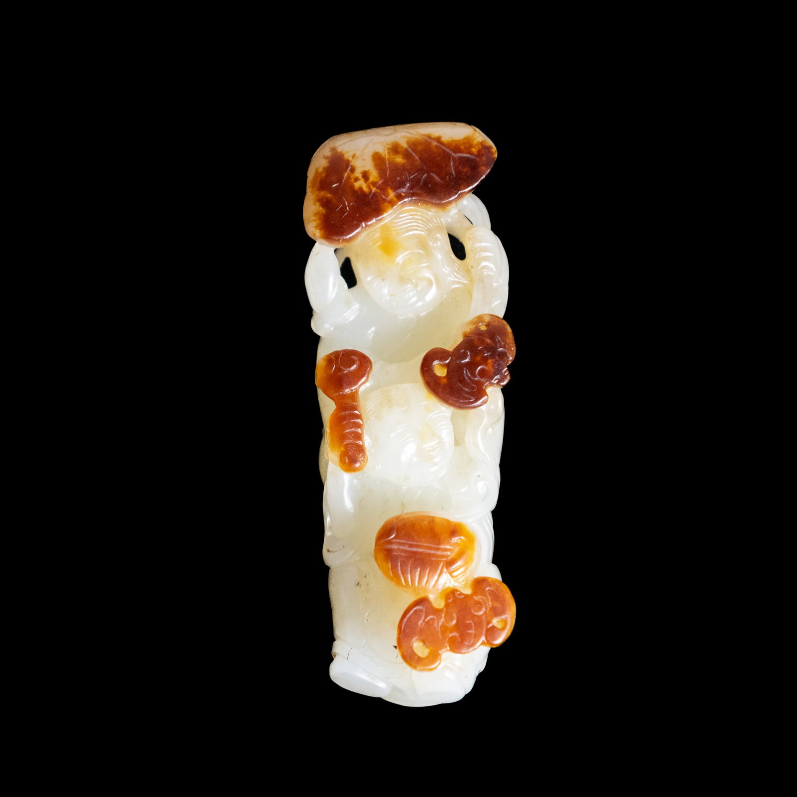 WHITE AND RUSSET JADE CARVING OF BOY AND BAT, QING DYNASTY (1 of 7)