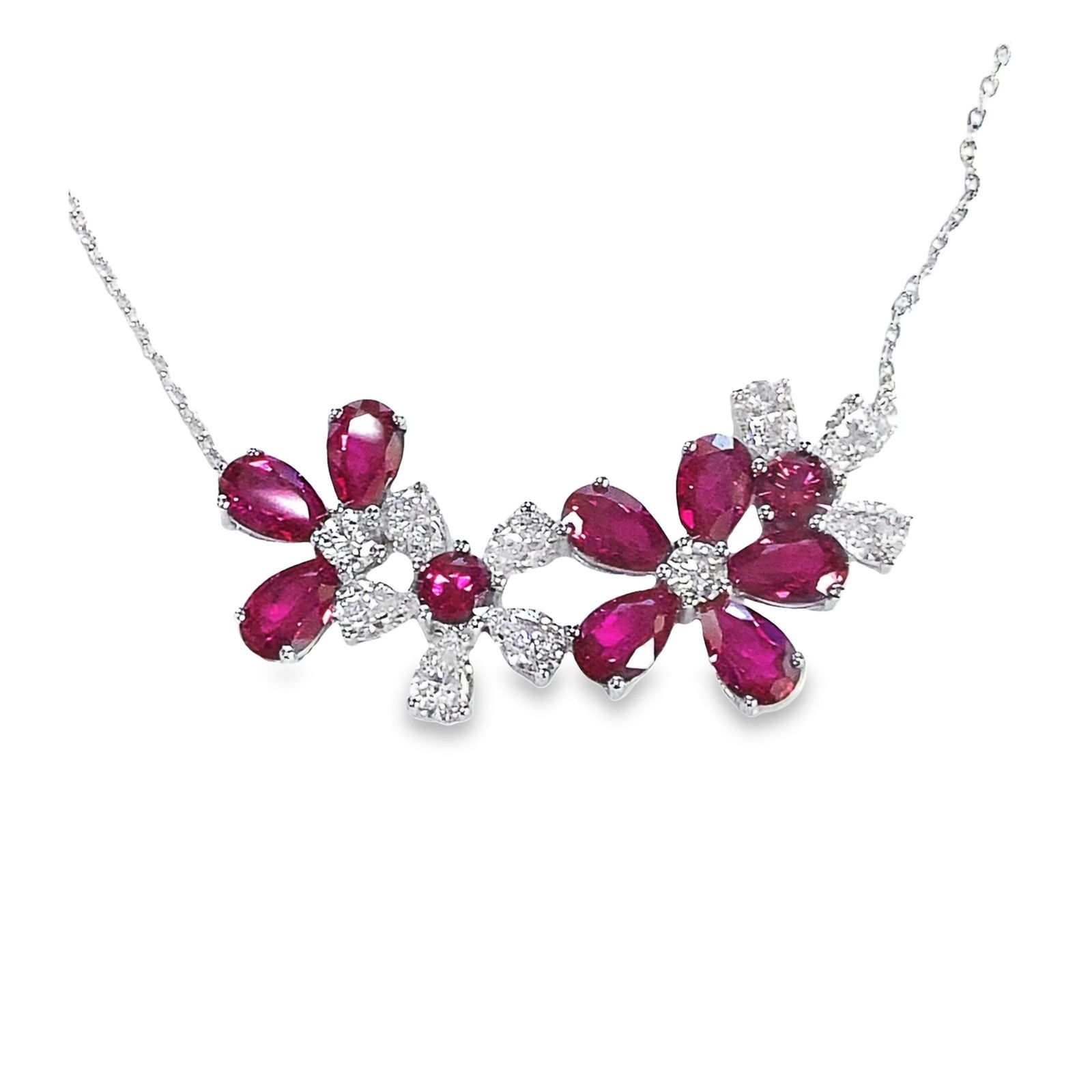 LAB-GROWN RUBY AND DIAMOND NECKLACE: Lab-grown ruby and diamond necklace. Pendant Overall: 0.79"h x 1.73"w (2 x 4.4 cm)