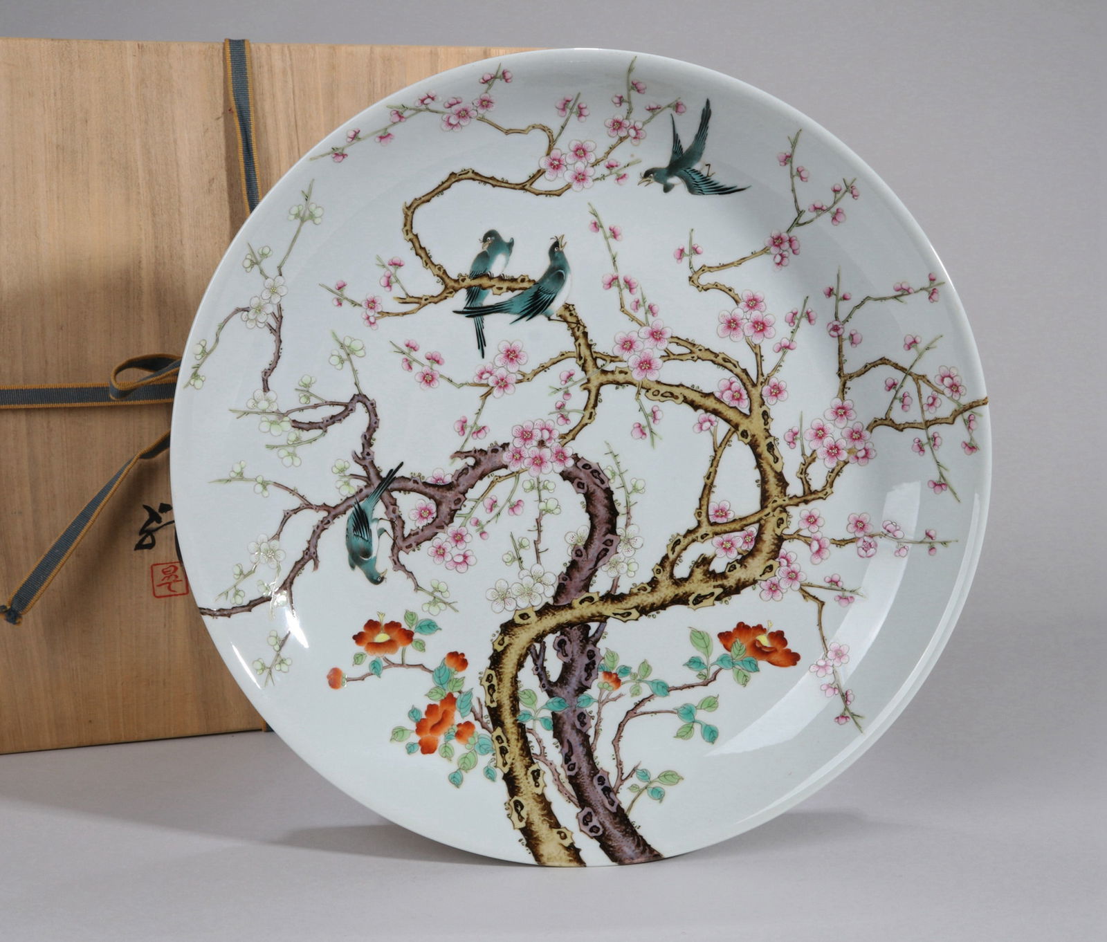 A FAMILLE-ROSE 'MAGPIES AND PLUM BLOSSOMS' DISH: A large famille-rose dish decorated with magpies and plum blossoms (Xi Shang Mei Shao).Diameter 36 cm.