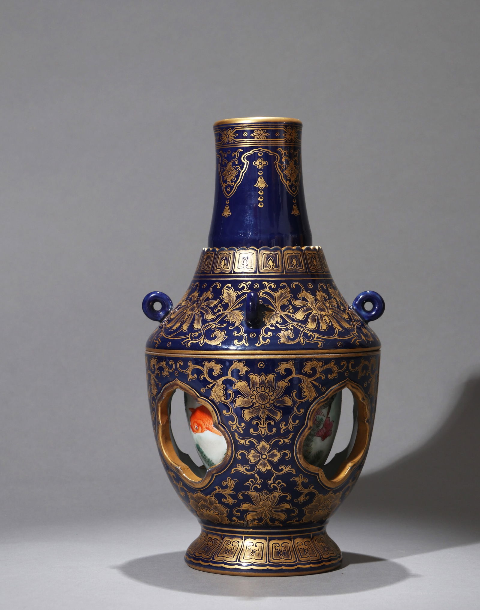 A BLUE-GLAZED GILT-DECORATED REVOLVING VASE (1 of 12)