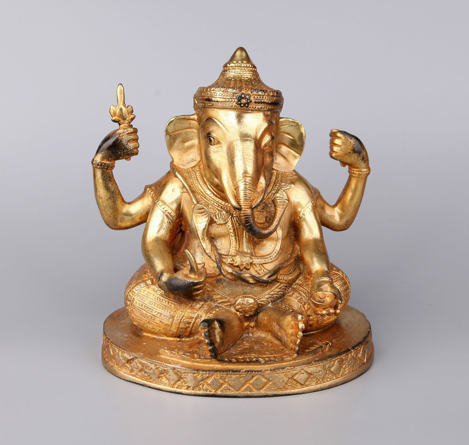 A GILT-BRONZE FIGURE OF JAMBHALA: A gilt-bronze figure of Elephant Jambhala.Height 18 cm.