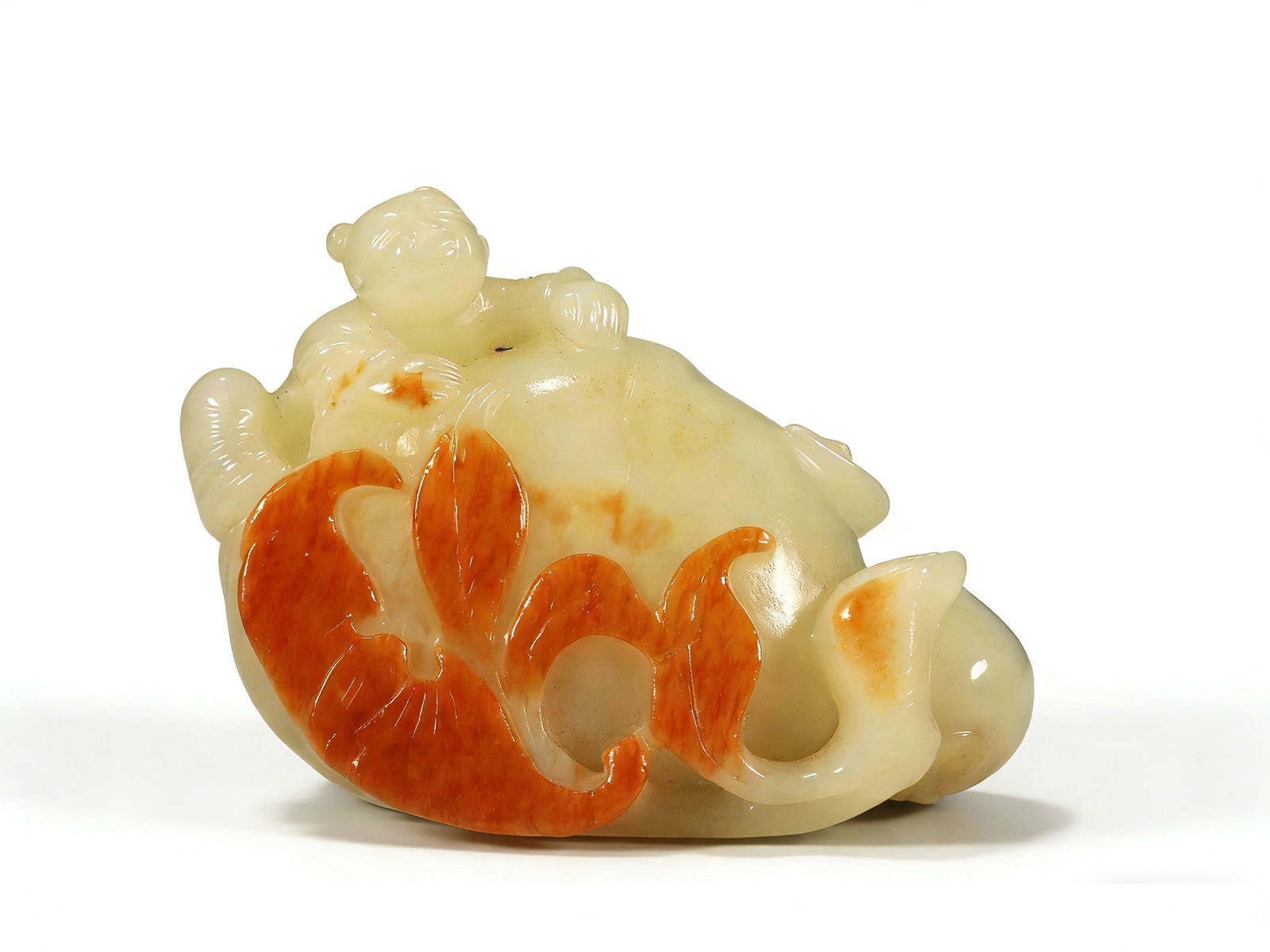 A JADE CARVING OF BOY: A Hetian jade carving of a boy offering longevity.7 x 4.5 x 6 cm.