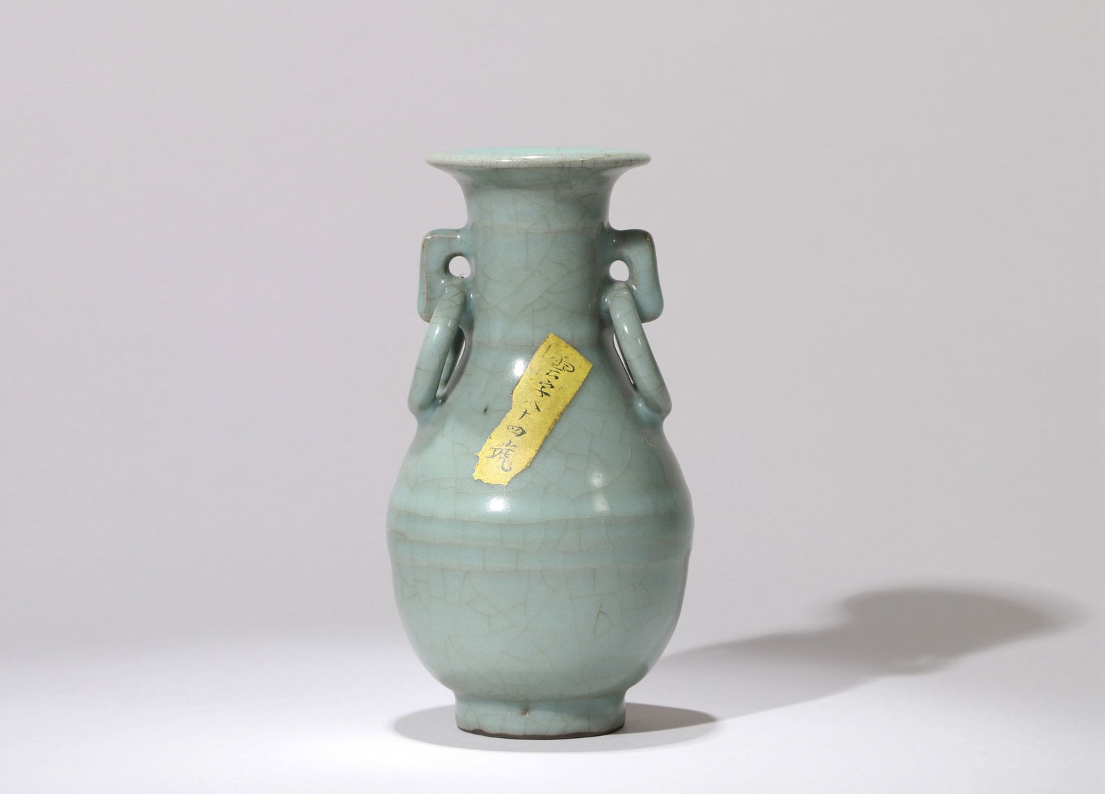A LONGQUAN CELADON VASE: A Longquan celadon vase with double loop handles.Height 15 cm.