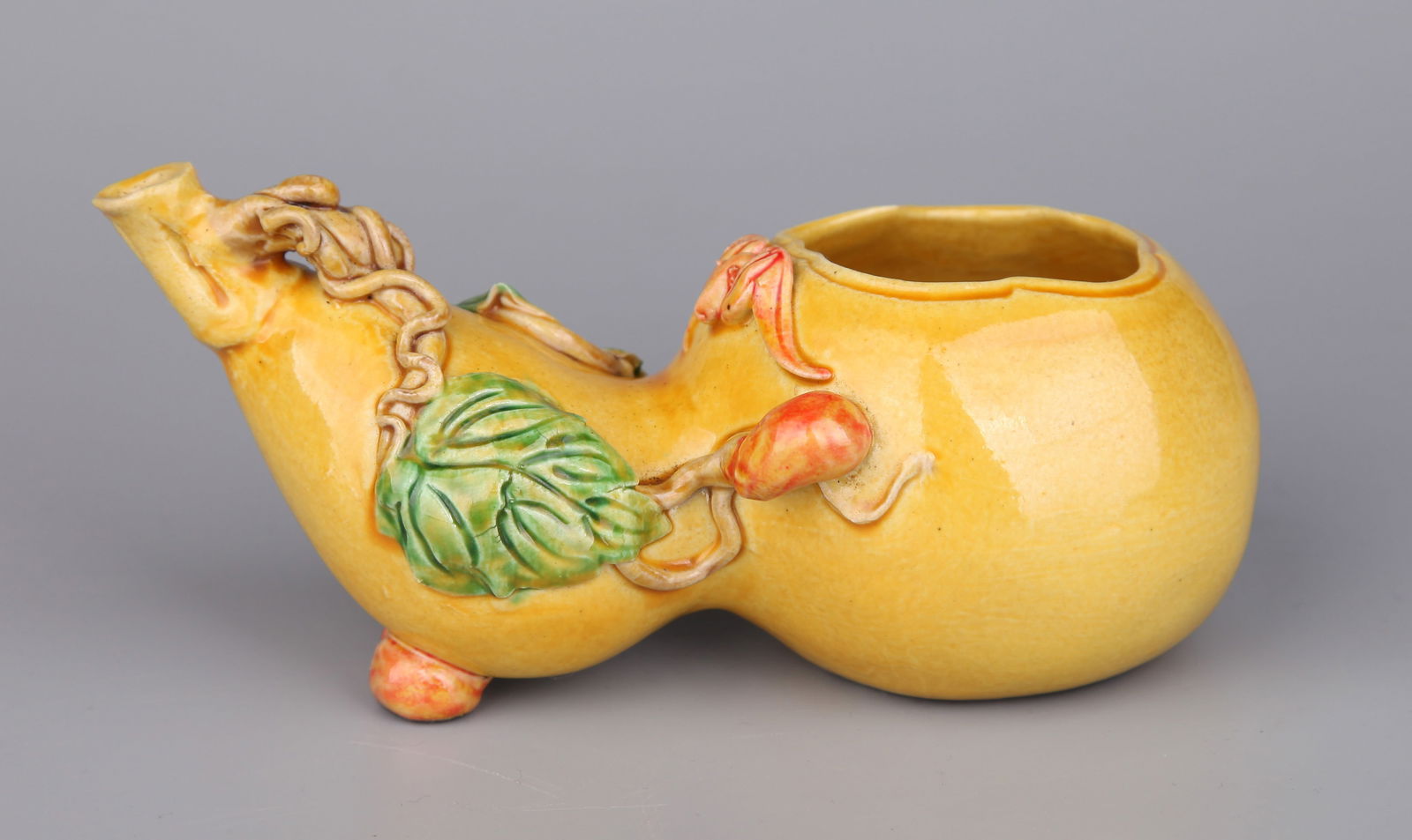 A YELLOW-GLAZED DROPPER