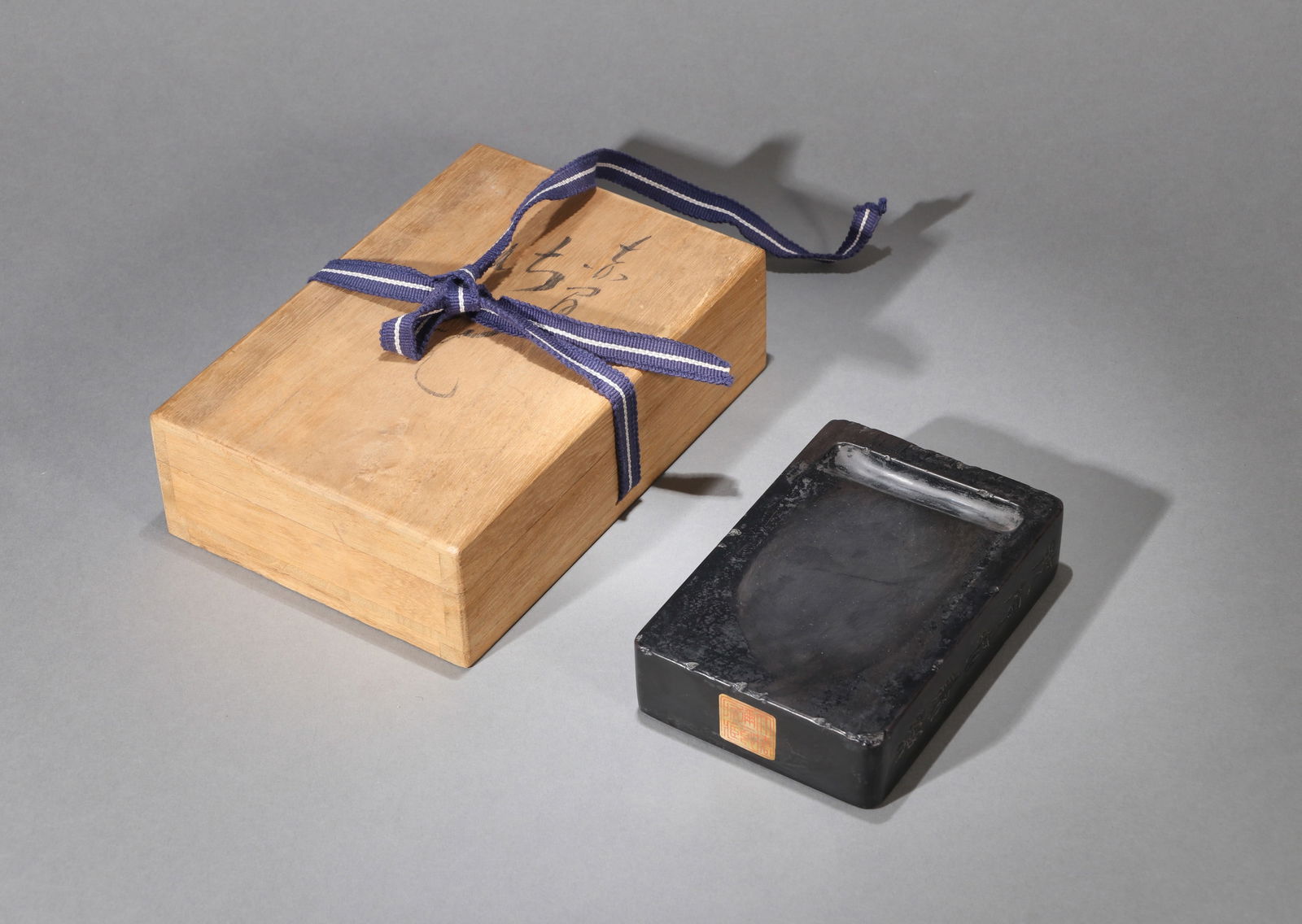 AN INSCRIBED DUAN INKSTONE: A Duan inkstone.13.5 x 9 x 3 cm.Note: With inscription attributed to Wu Changshuo.