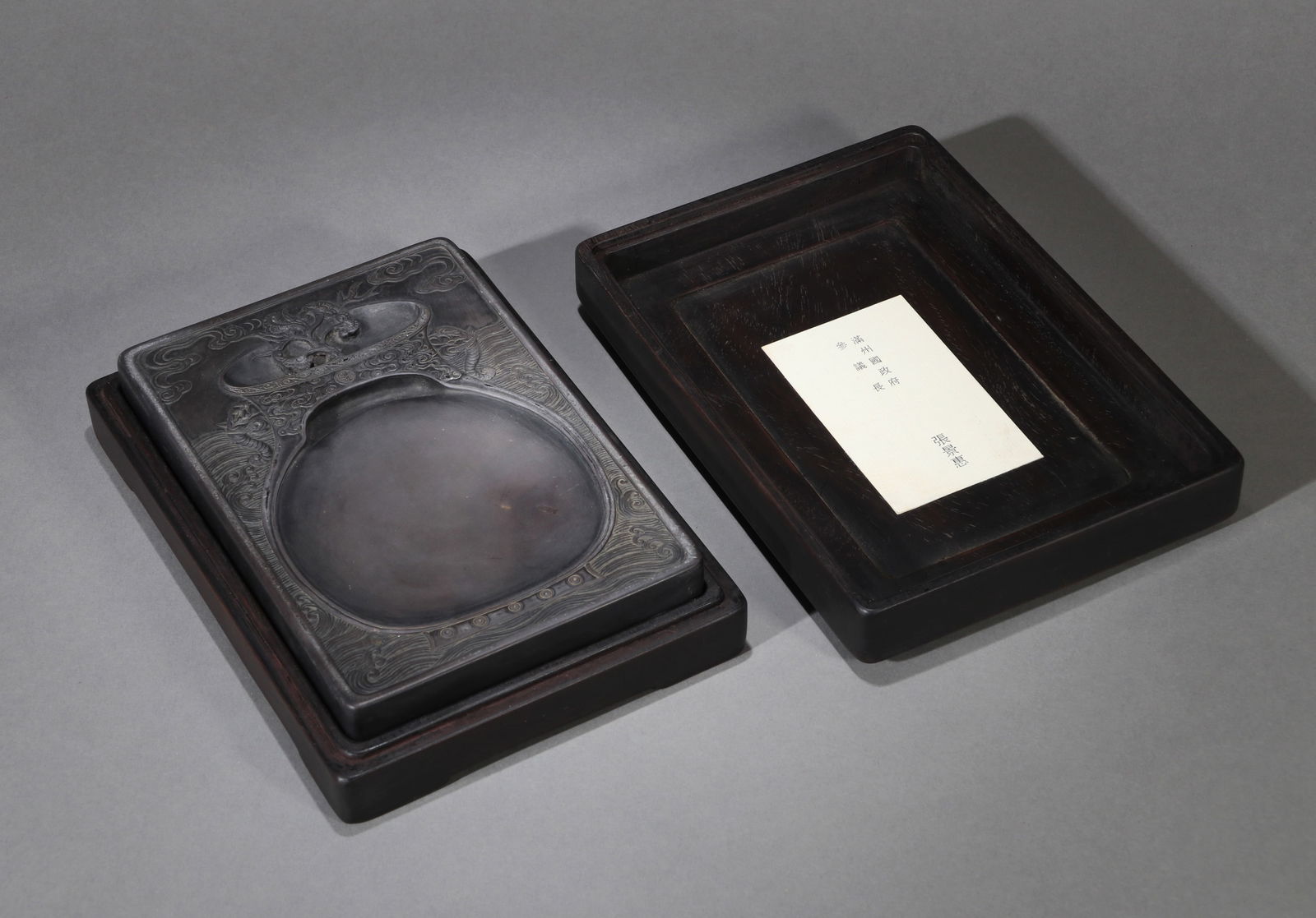 A DUAN INKSTONE: A Duan inkstone decorated with elephant design (Taiping Youxiang).17.5 x 12 x 2.5 cm.