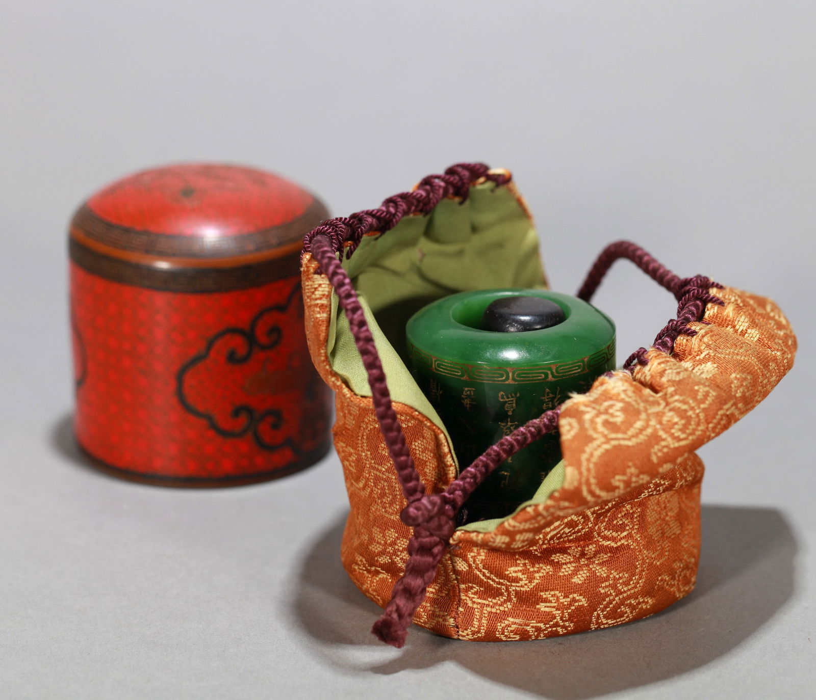 A SPINACH GREEN JADE ARCHER'S RING WITH INSCRIPTION (1 of 12)