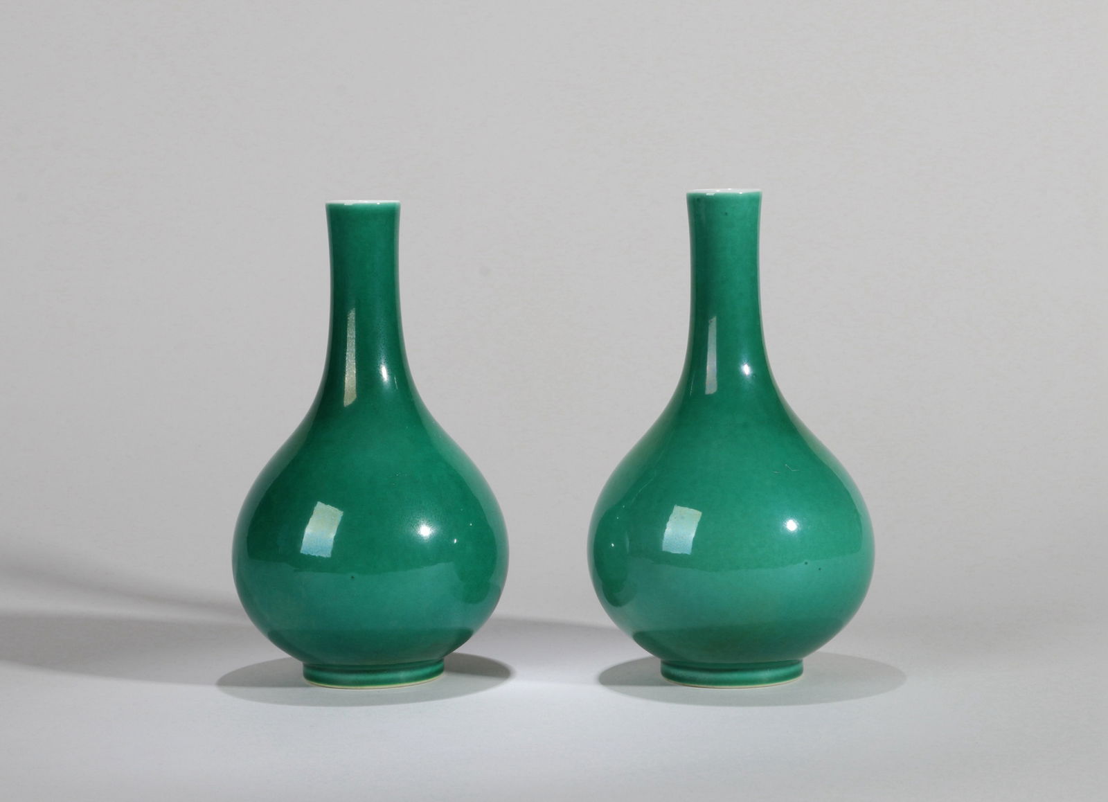 A PAIR OF CUCUMBER-GREEN GLAZED VASES (1 of 5)
