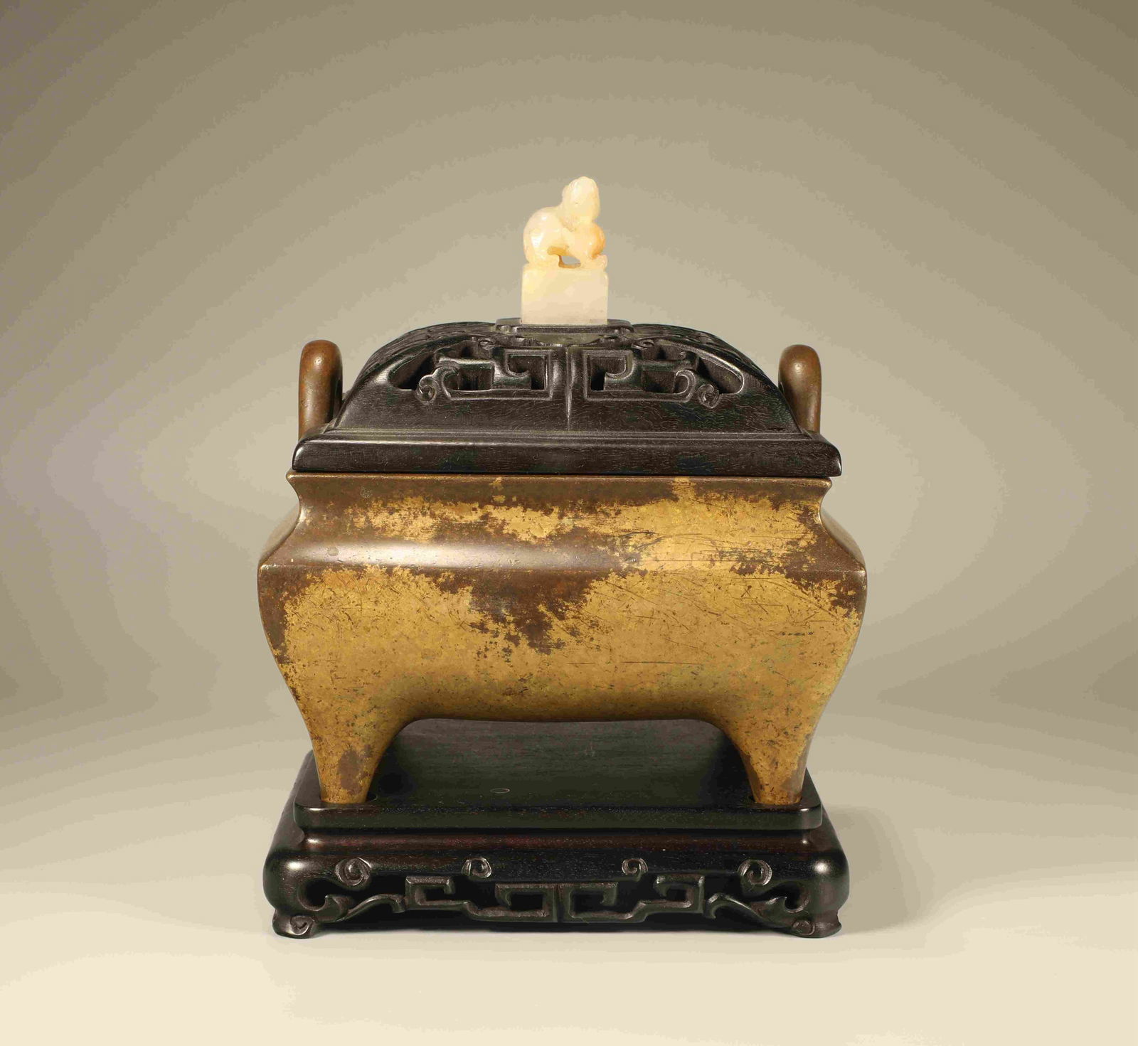 A BRONZE BRIDGE-EAR CENSER: A bronze square censer with bridge-shaped ears. Height 22 cm.