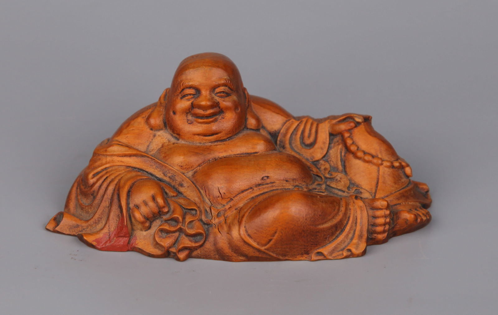 A BOXWOOD FIGURE OF MAITREYA (1 of 5)