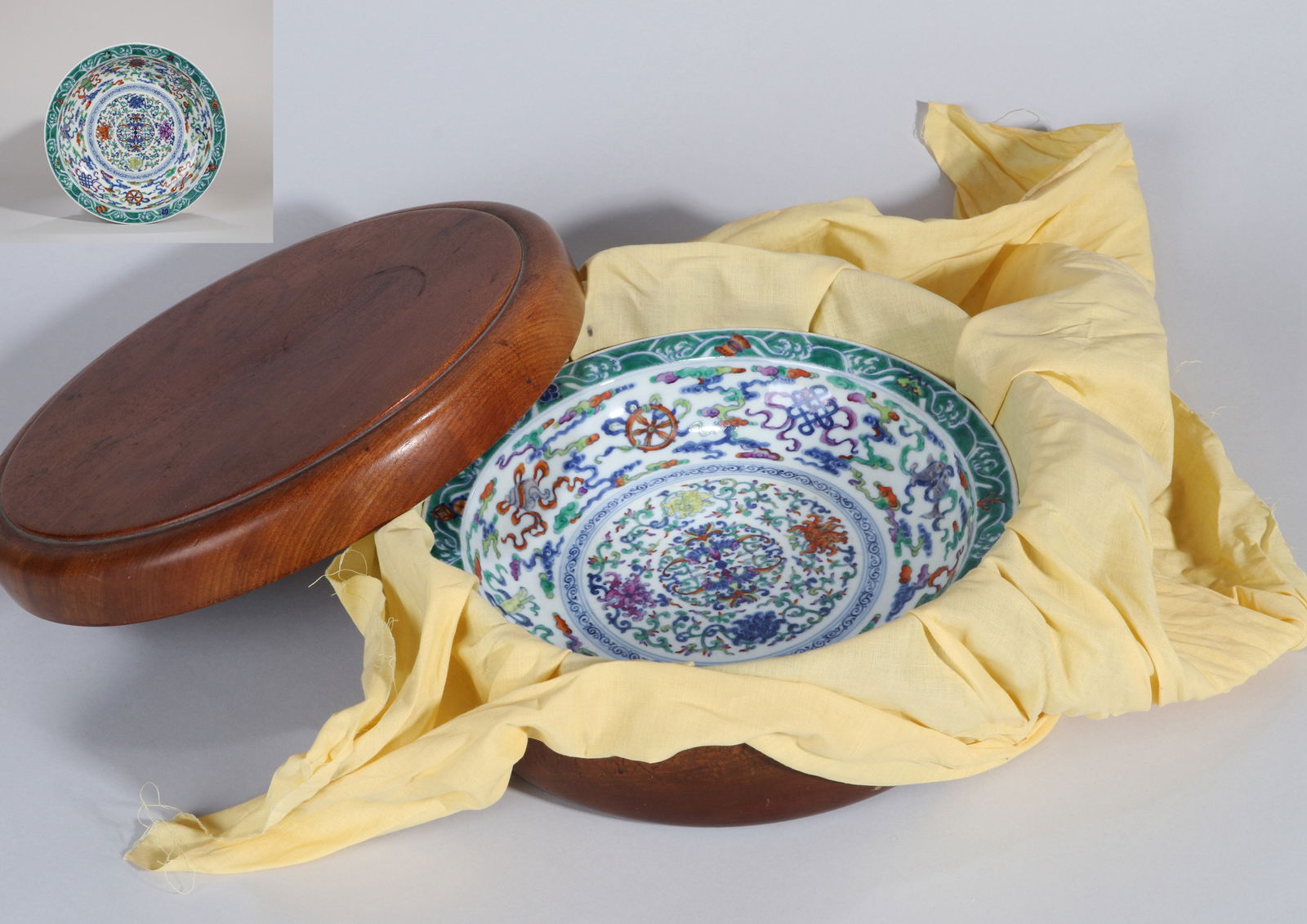 A DOUCAI DISH: A Doucai dish decorated with Eight Buddhist Emblems and flowers.Diameter 26 cm.
