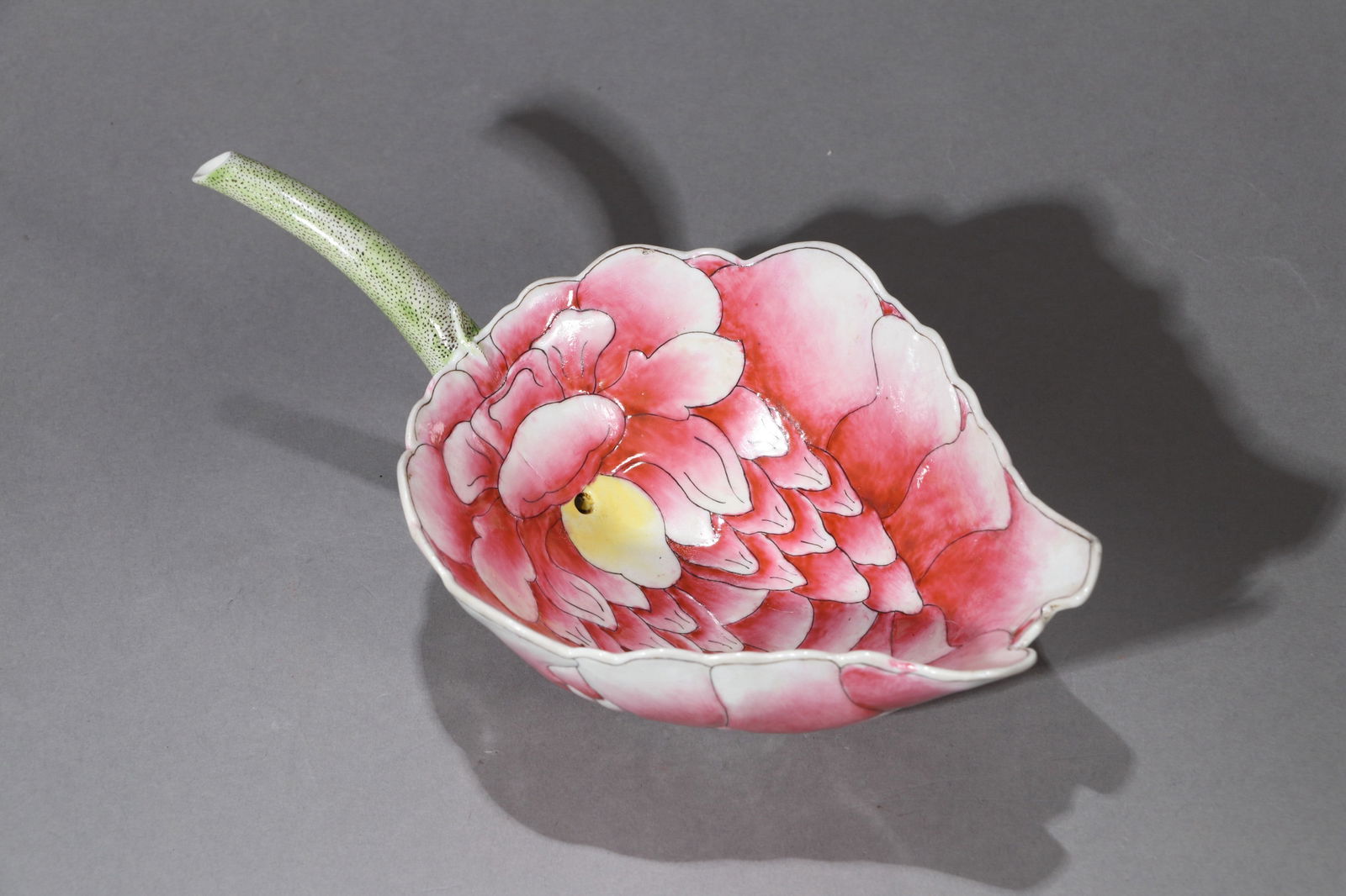 A FAMILLE-ROSE 'LOTUS' CUP: A famille-rose cup in the shape of a lotus leaf (Xi Bei). Length 19.5 cm.