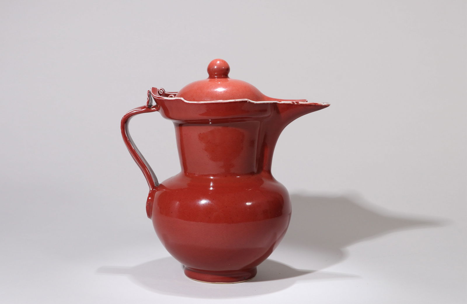 A COPPER-RED GLAZED MONK'S CAP EWER (1 of 7)