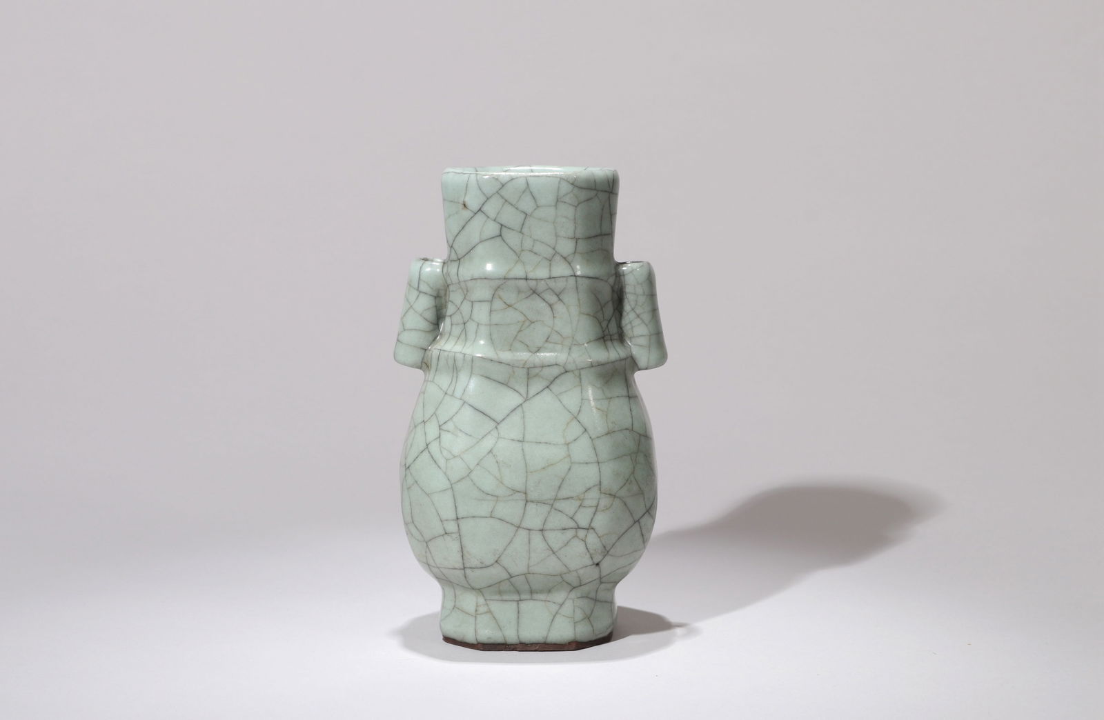 A GUAN-TYPE VASE: A Guan-type vase with tubular handles.Height 15 cm.