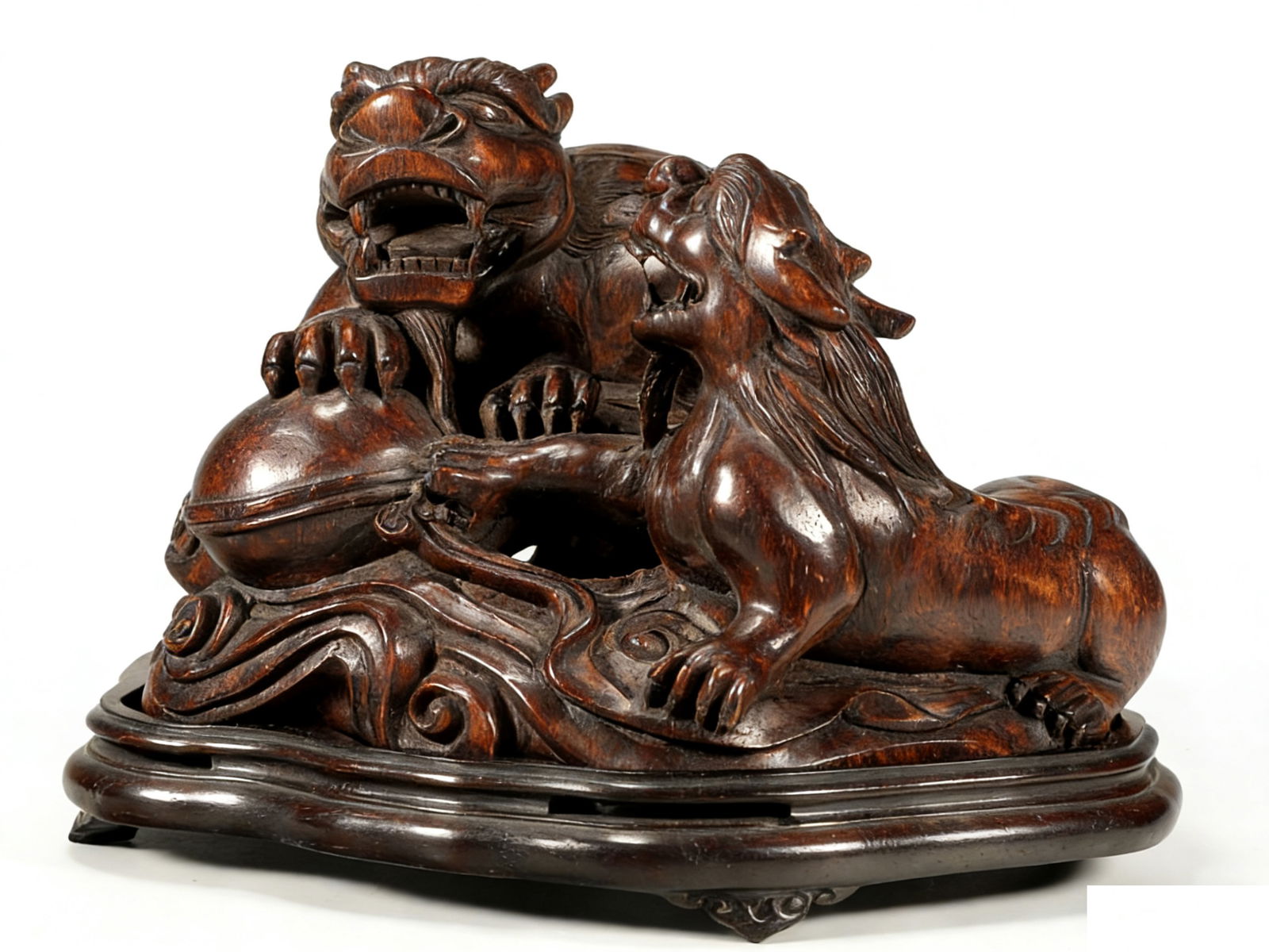 A CARVED AGARWOOD CENSER: A carved agarwood censer decorated with Pixiu.16 x 19 x 16 cm.