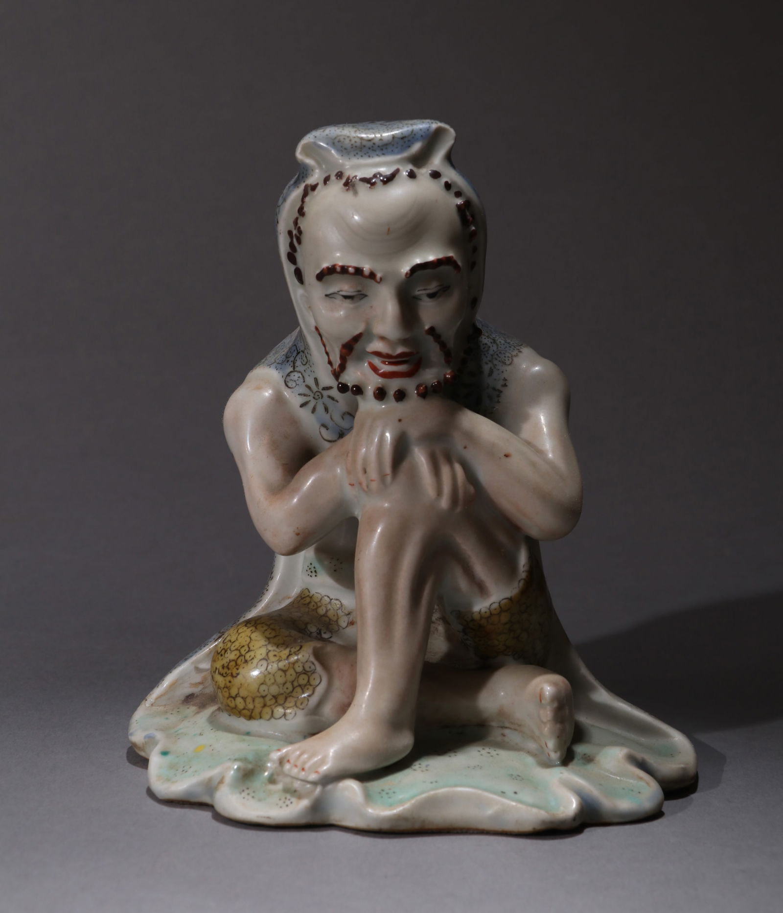 A FAMILLE-ROSE FIGURE OF LUOHAN: A famille-rose figure of Luohan.Height 14.5 cm.