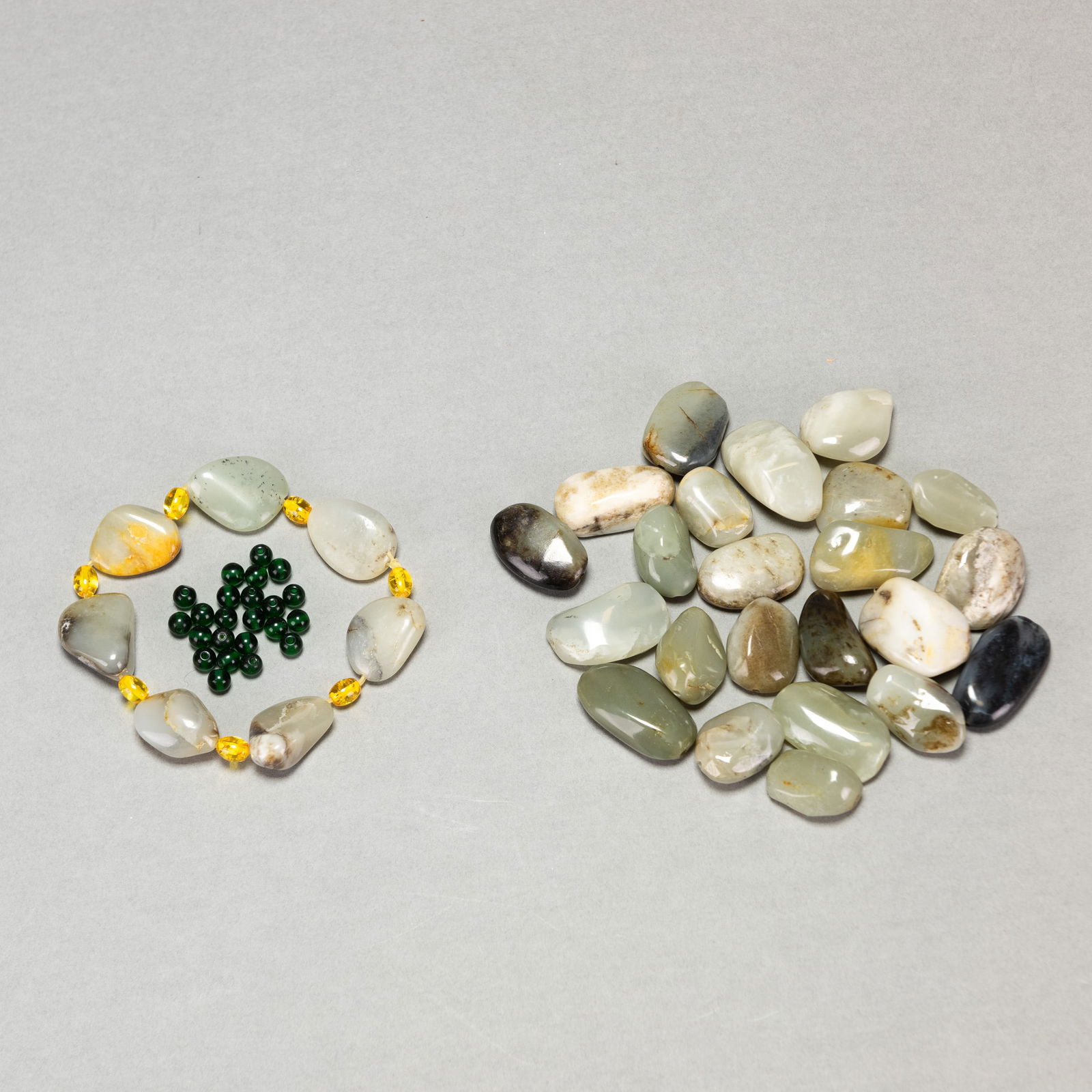 GROUP OF JADE, JADEITE AND GEMSTONES: Group of jade, jadeite, and gemstones.Dimensions: Bracelet (11cm x2)Stone x 23 (approx. 1.5 x 2.5 cm)Bead x 23 (D 3 mm)